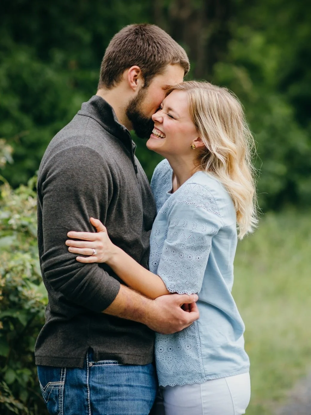 Couple holding each other and giggling by local Northern Virginia VA Photographer.