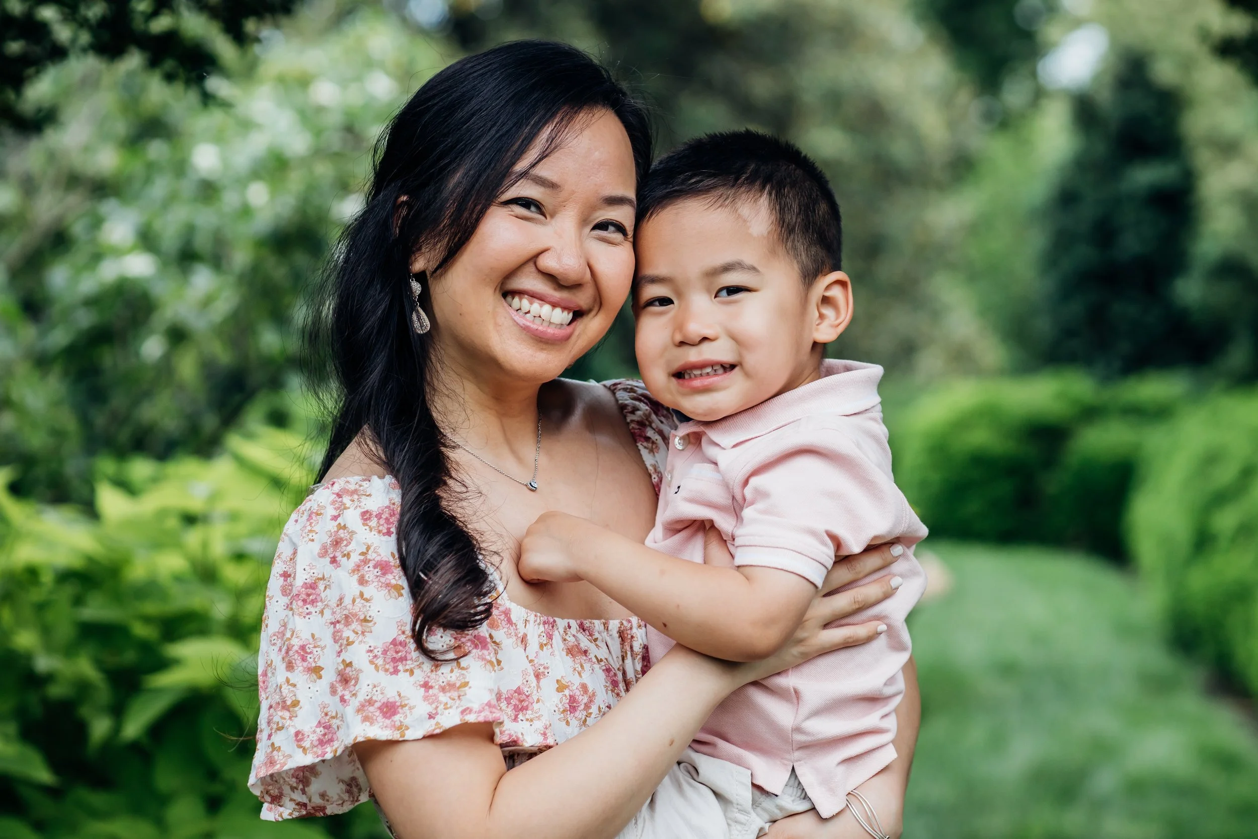 Mom and son hugging and smiling