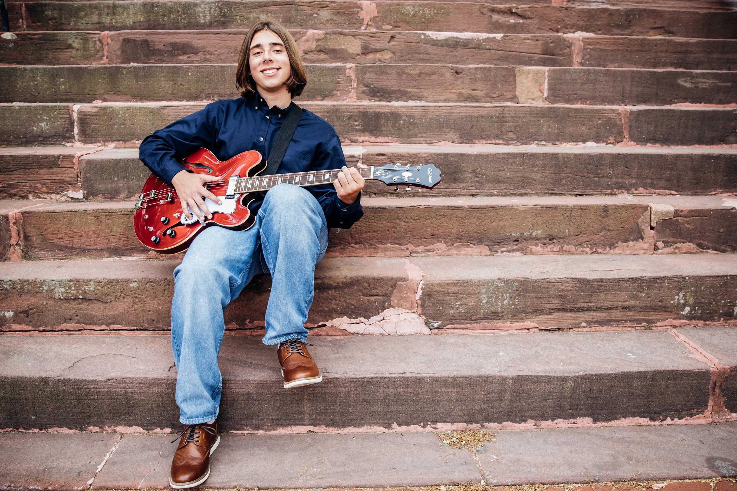 High School Senior playing guitar on the steps in Warrenton VA