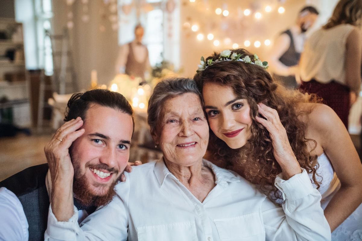 Wedding couple sharing precious time with elderly grandparent  who is included at the celebrations on their Wedding Day.