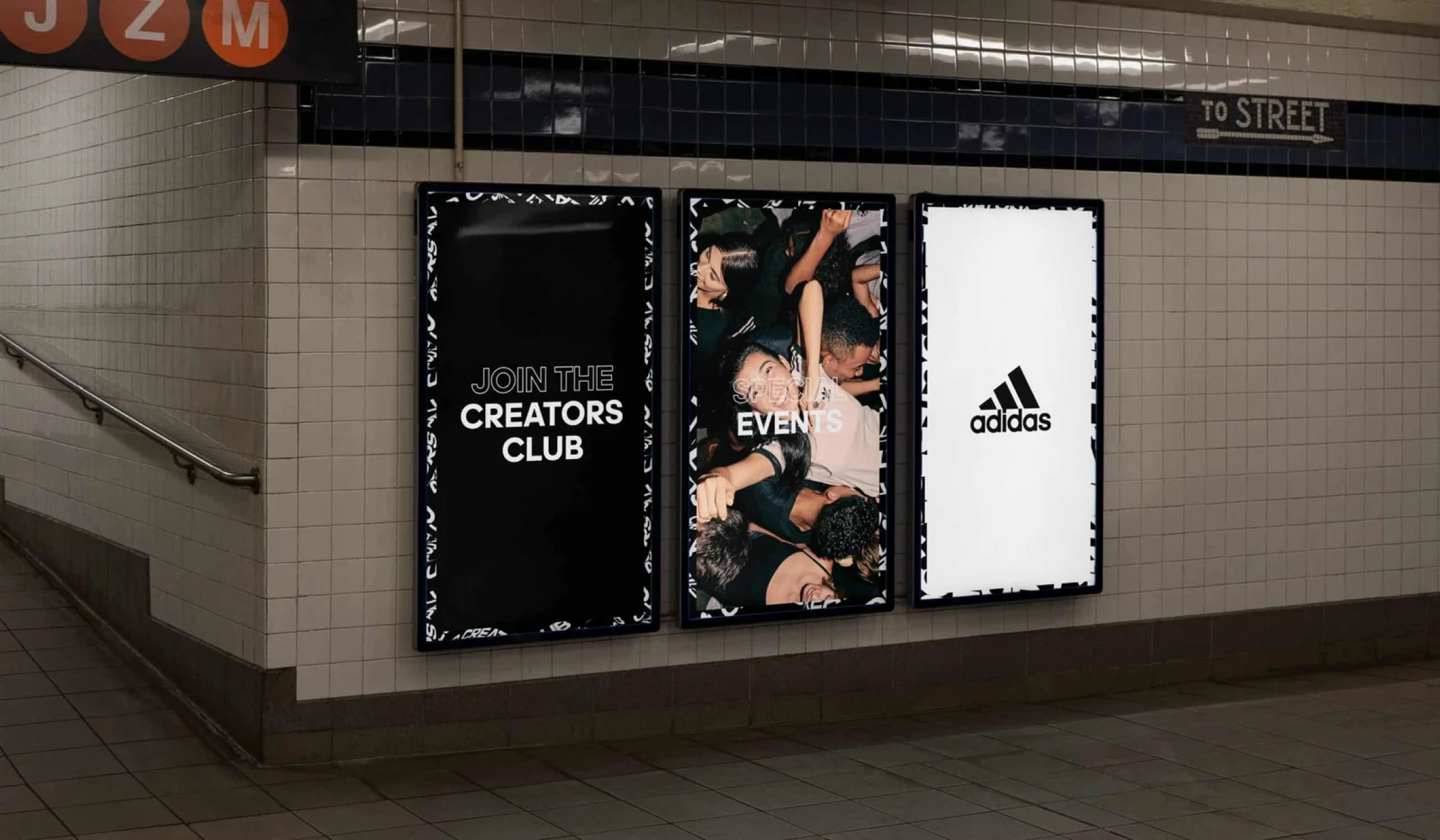Subway station wall with three Adidas ads: one for "Creators Club," one showing people at an event, and one with the Adidas logo.