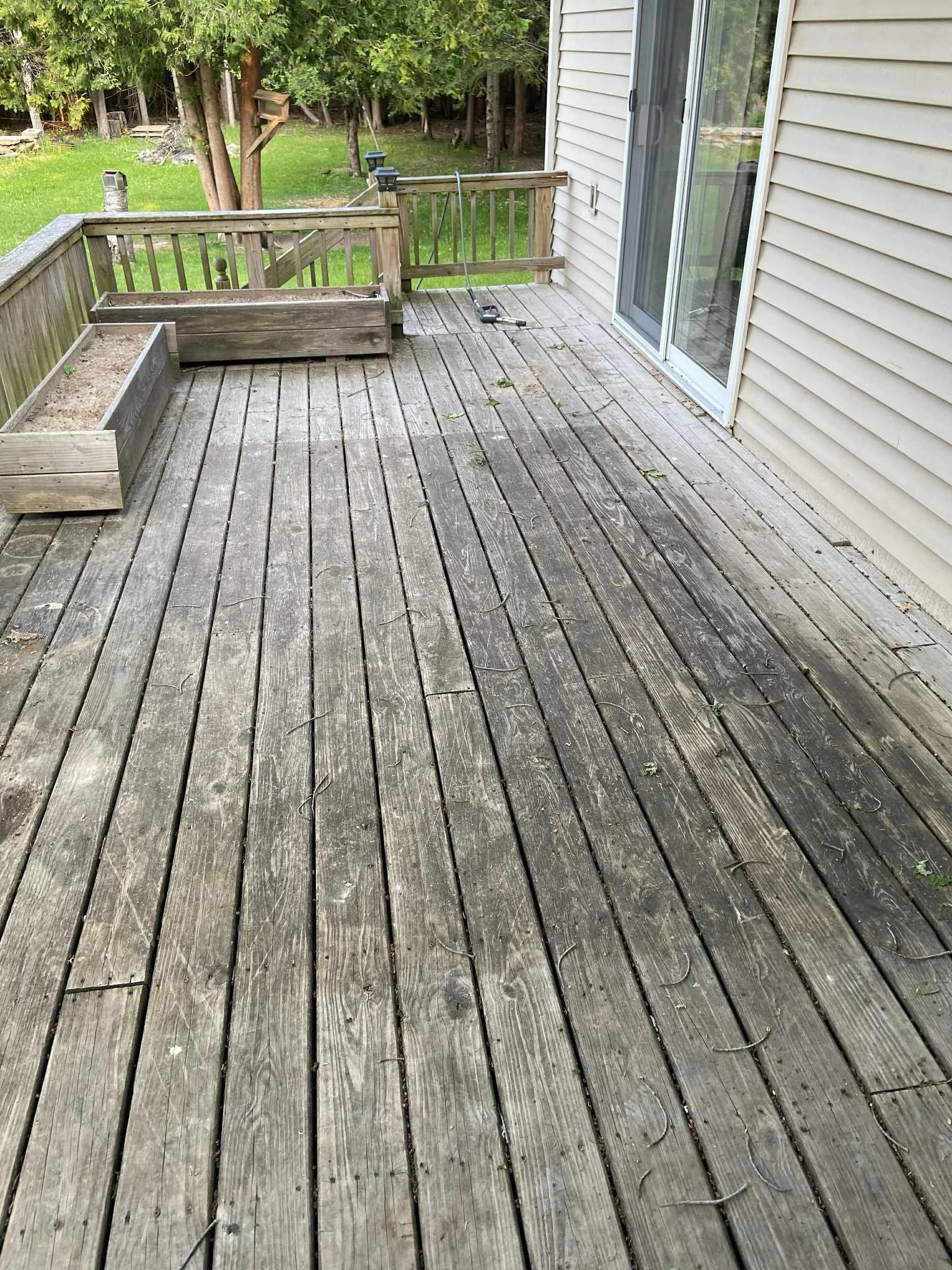 Before a proper cleaning, deck looks aged from time and weathering.