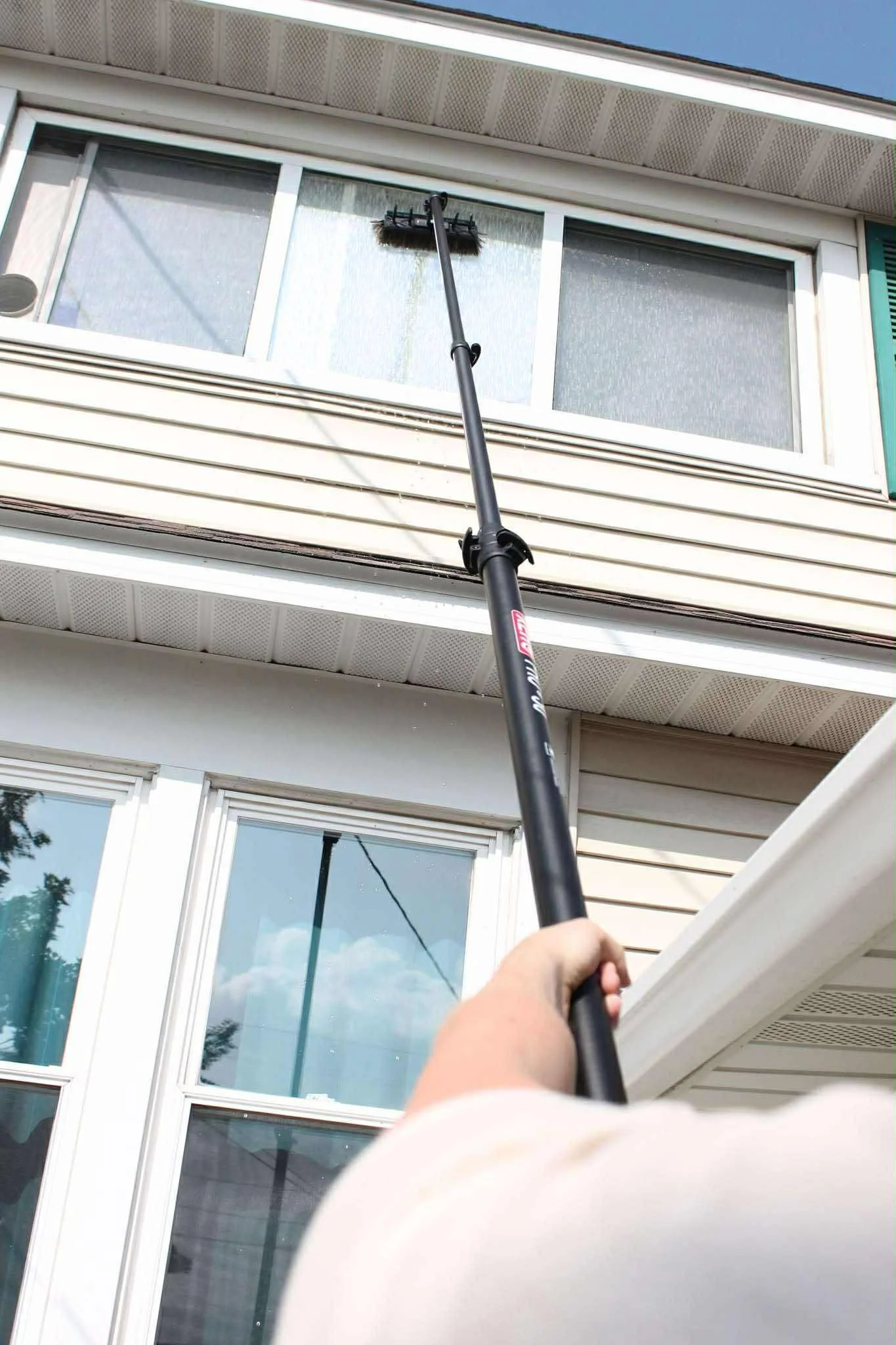 Second story windows are easily reached without the risk of climbing a ladder with a pole-fed system
