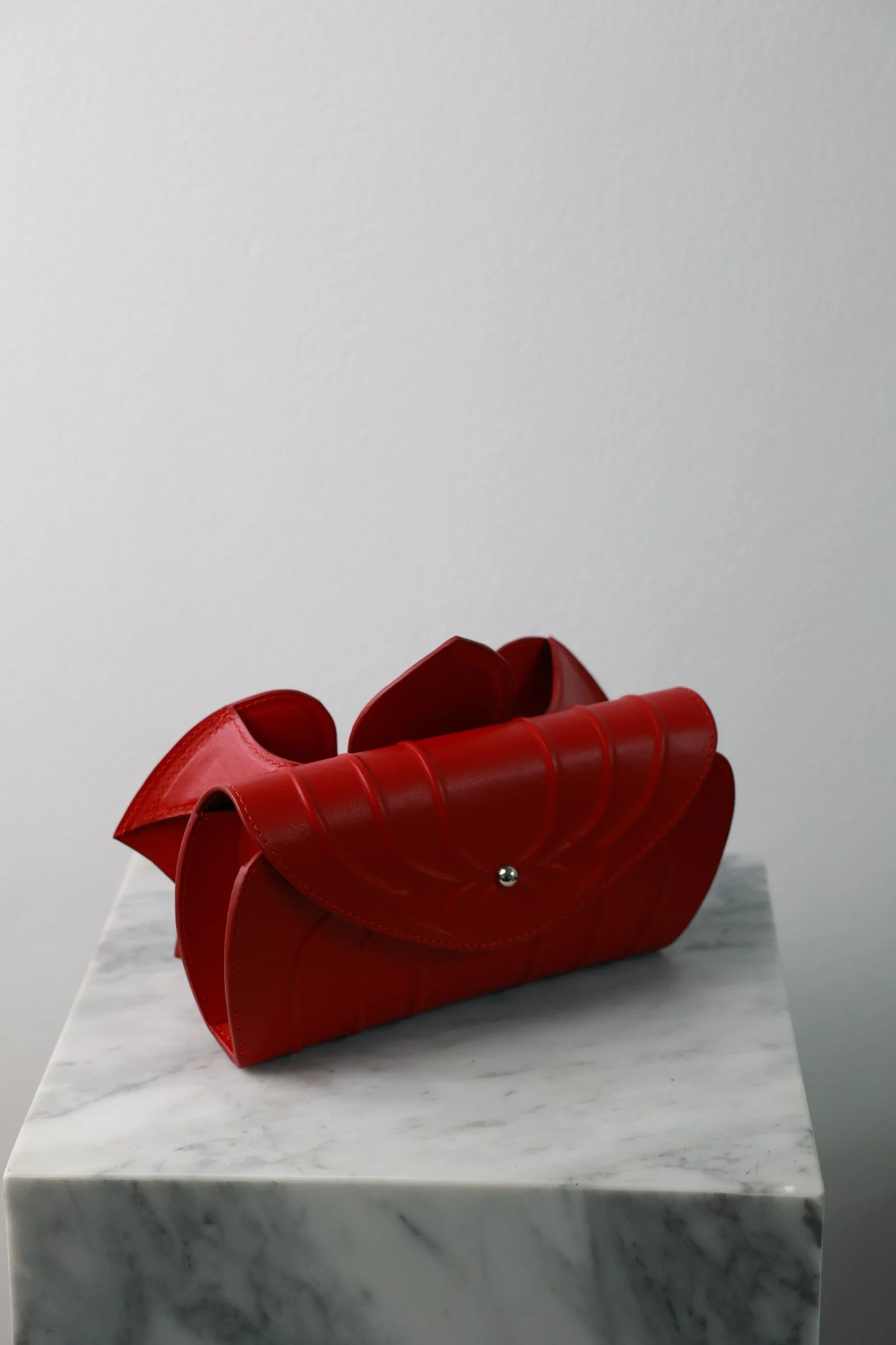Orchid Clutch by YS Atelier: back view of the ribbed red leather clutch body