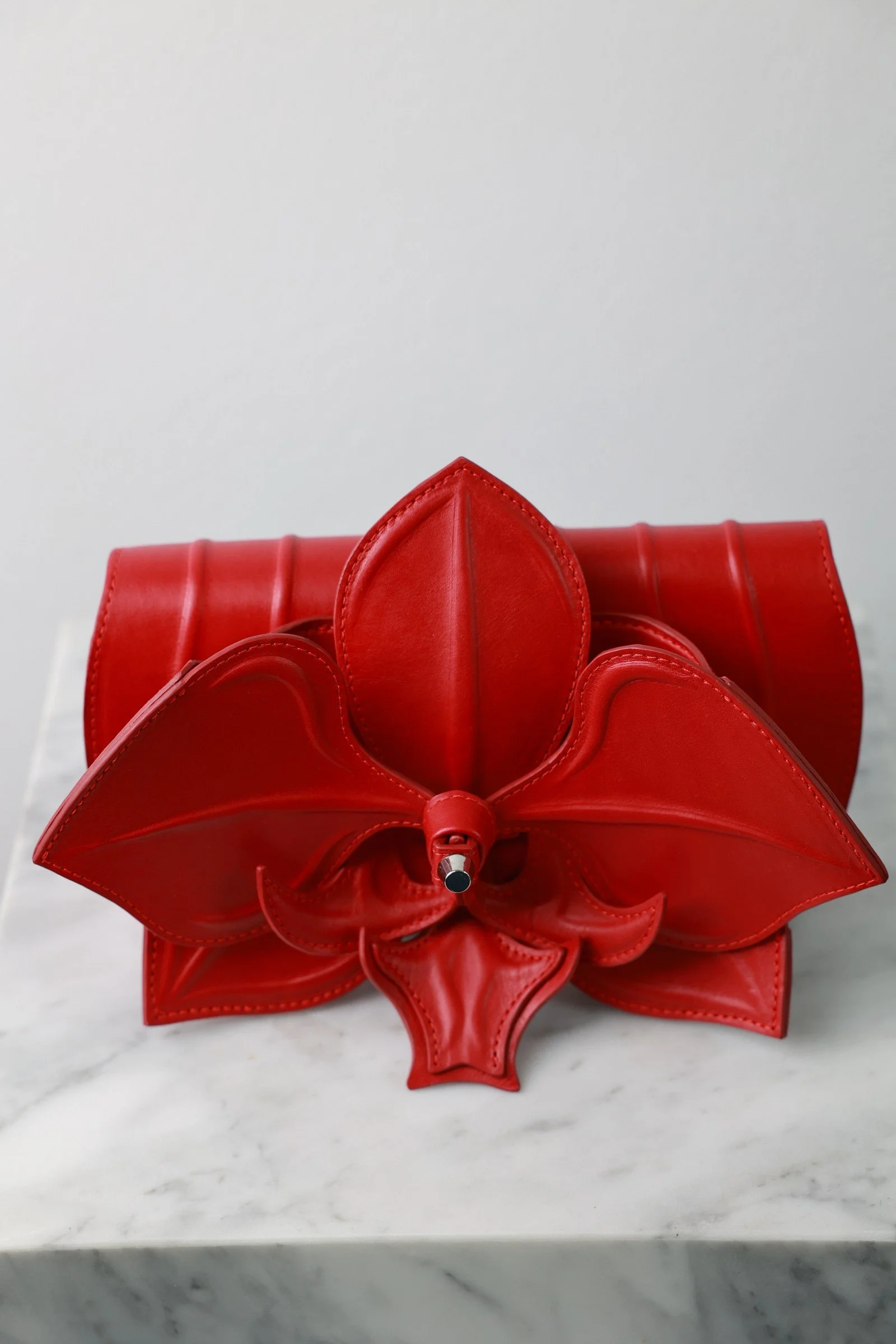 Orchid Clutch by YS Atelier: front view showing layered red leather petals