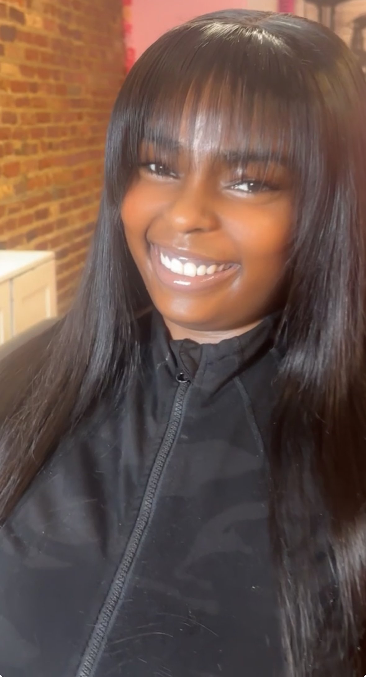 Quickweave install with leave-out and soft bangs on Black woman in Philadelphia salon”