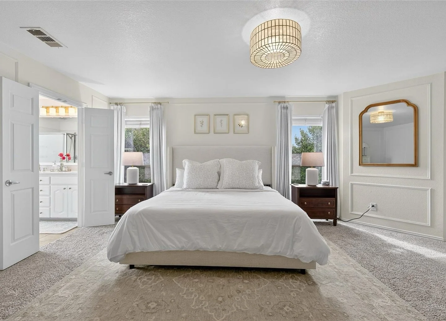 Gorgeous custom updates to this primary suite include picture moulding and a statement light fixture, not to mention new counters and fixtures in the ensuite bathroom. Everything about this refreshed room says STYLE 🤩 Open House tomorrow from 1&ndas