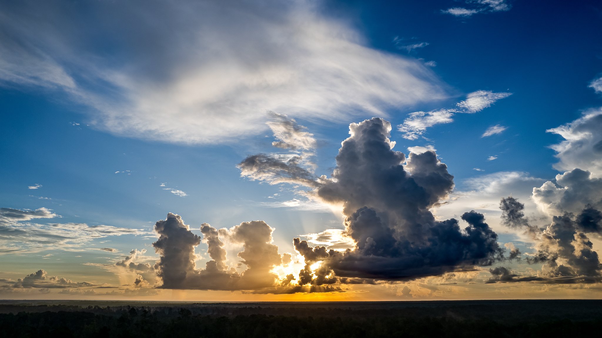 Aerial image of a fading thunderstorm at sunset