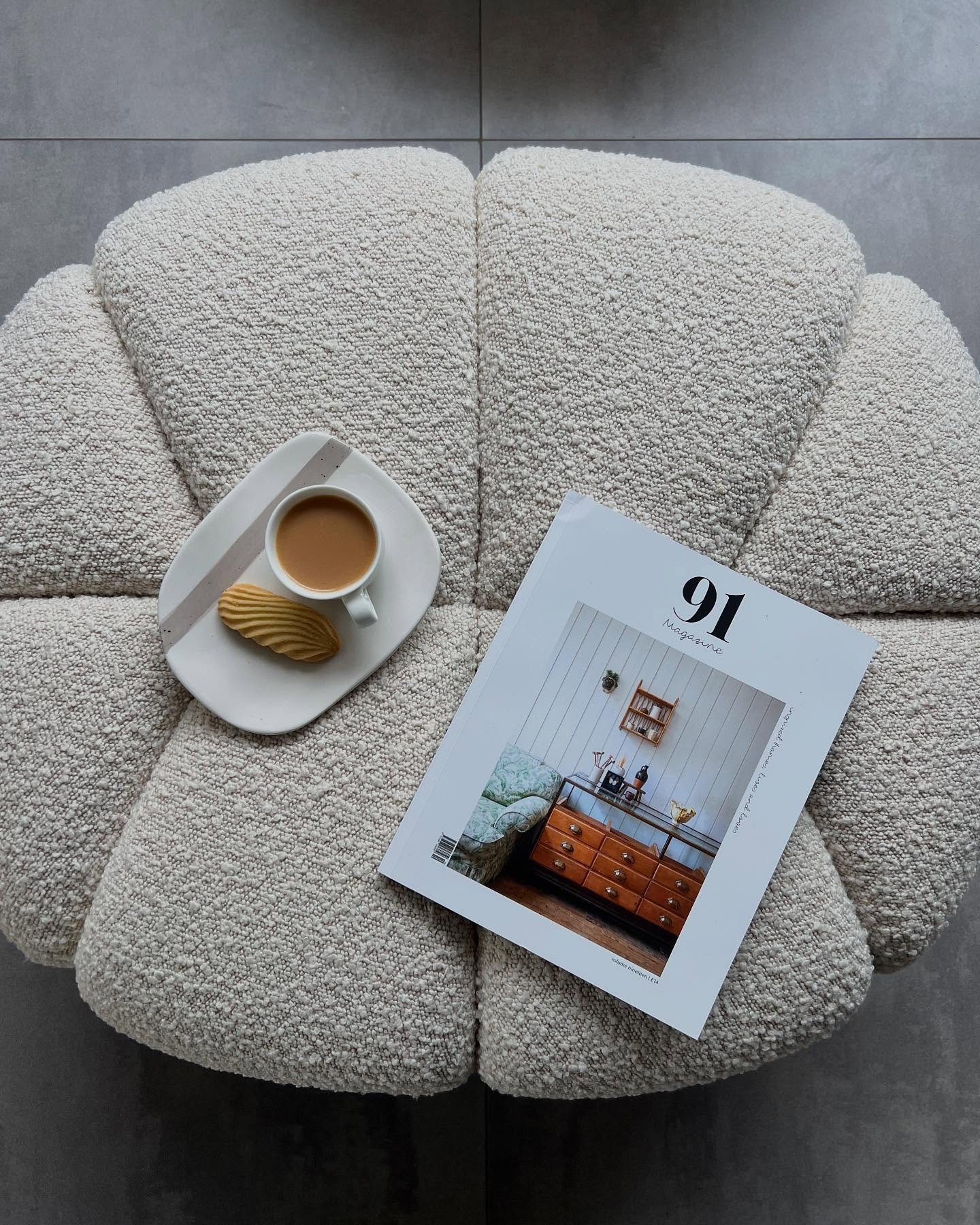 Sunday morning essentials. Tea + biscuit + magazine @91magazine is my fave and a proper treat. Footstool for those asking is the Garret footstool in boucle from @sohohome