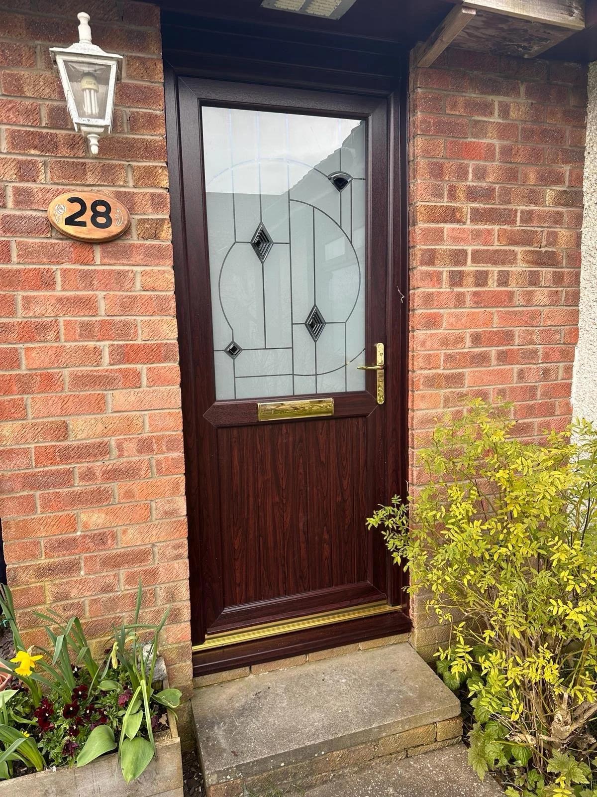 Rosewood:White Upvc Front door with special glass design (which can be seen in our showroom) and Gold ironmongery installed in Houston last week.JPG