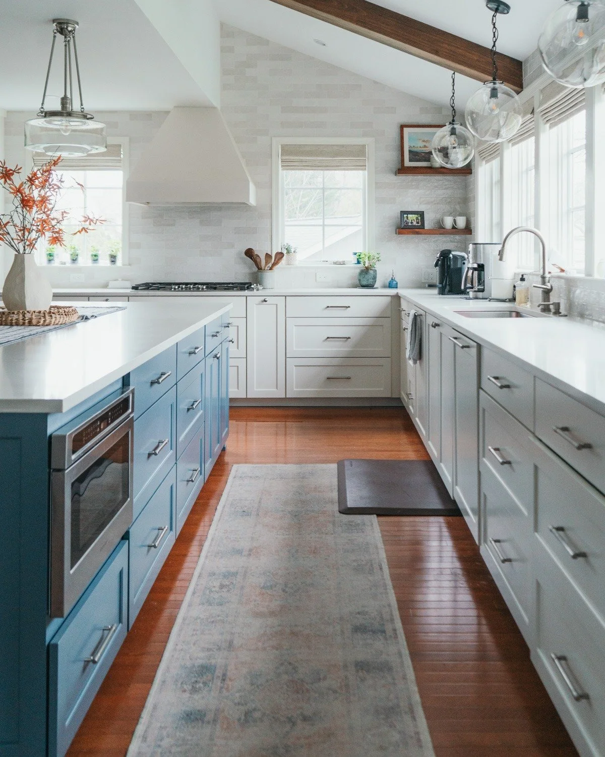 Bright, functional, and full of custom character ✨

This stunning kitchen remodel features cabinetry crafted by @wc.woodworks &mdash; blending timeless design with personalized detail. From the bold blue island to the clean white perimeter cabinets, 