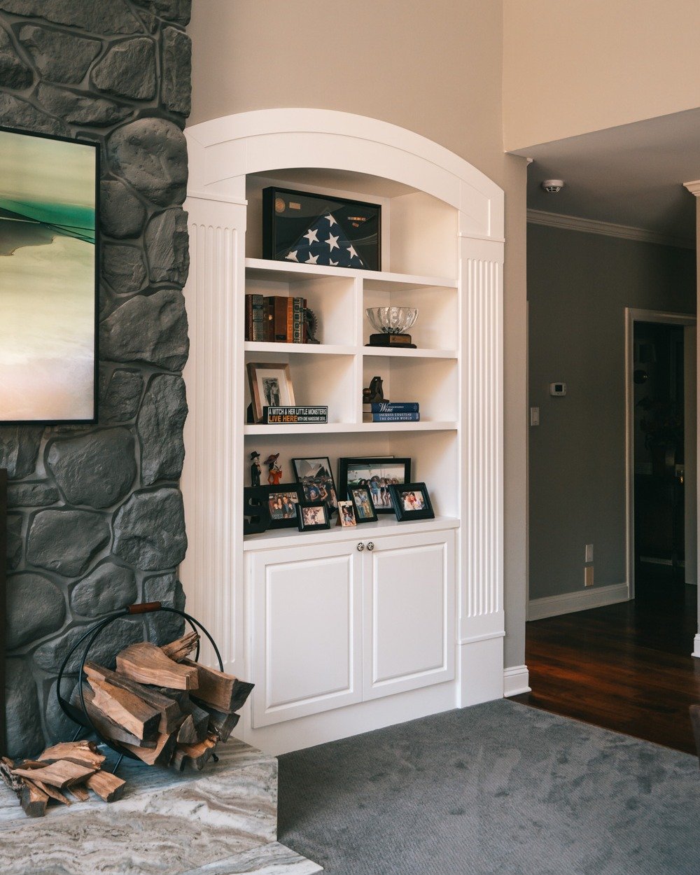 Creating space for the things that matter most. These custom-built shelves were designed to hold family memories, stories, and moments you never want to forget.

#makeithome #homedesign #devonpa #customcabinetry