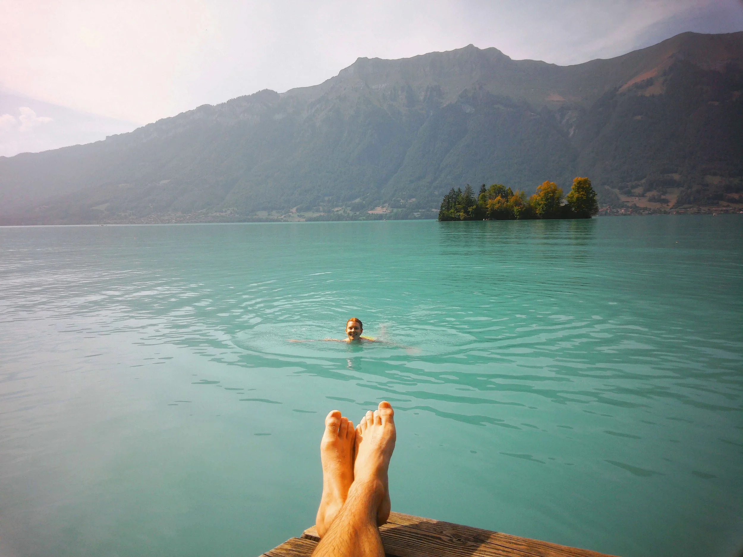 Cooling off in Lake Brienz, Switzerland on our hike through the Three Waterfalls Trail