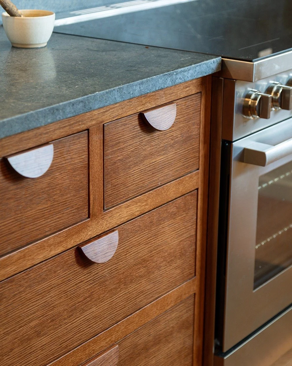 Details of a special kitchen in Delancey, NY, as part of a larger renovation of an eclectic family retreat. Style is refined but also playful and inviting. Stained oak inset cabinets with custom pulls, painted uppers, and soapstone countertops.

Phot