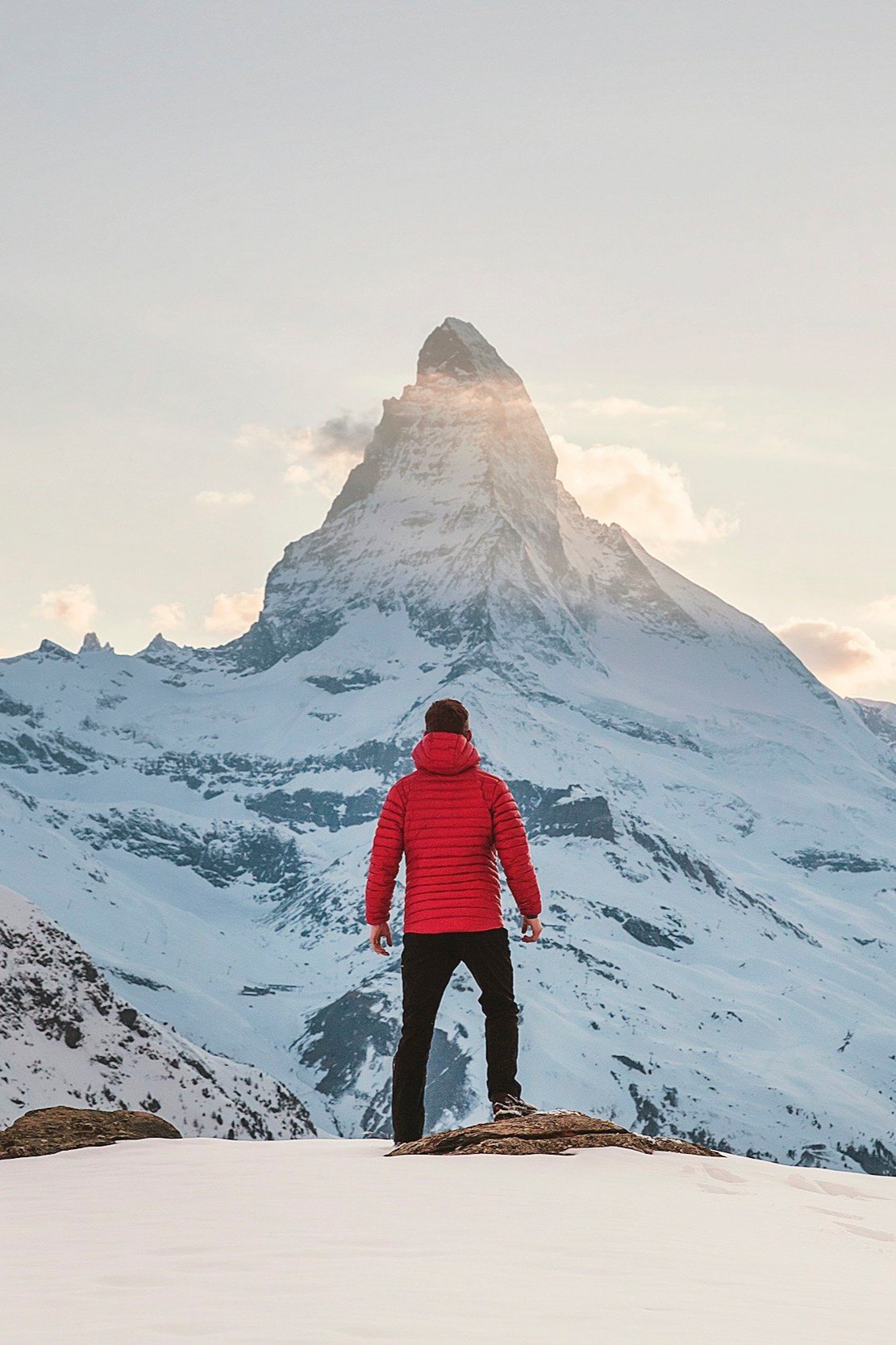 Best luxury travel adventures featuring skiing in stunning alpine resorts and luxury hiking through breathtaking landscapes. Scenic mountain views with skiers and hikers enjoying exclusive experiences. Matterhorn and Zermatt in Switzerland and spa.