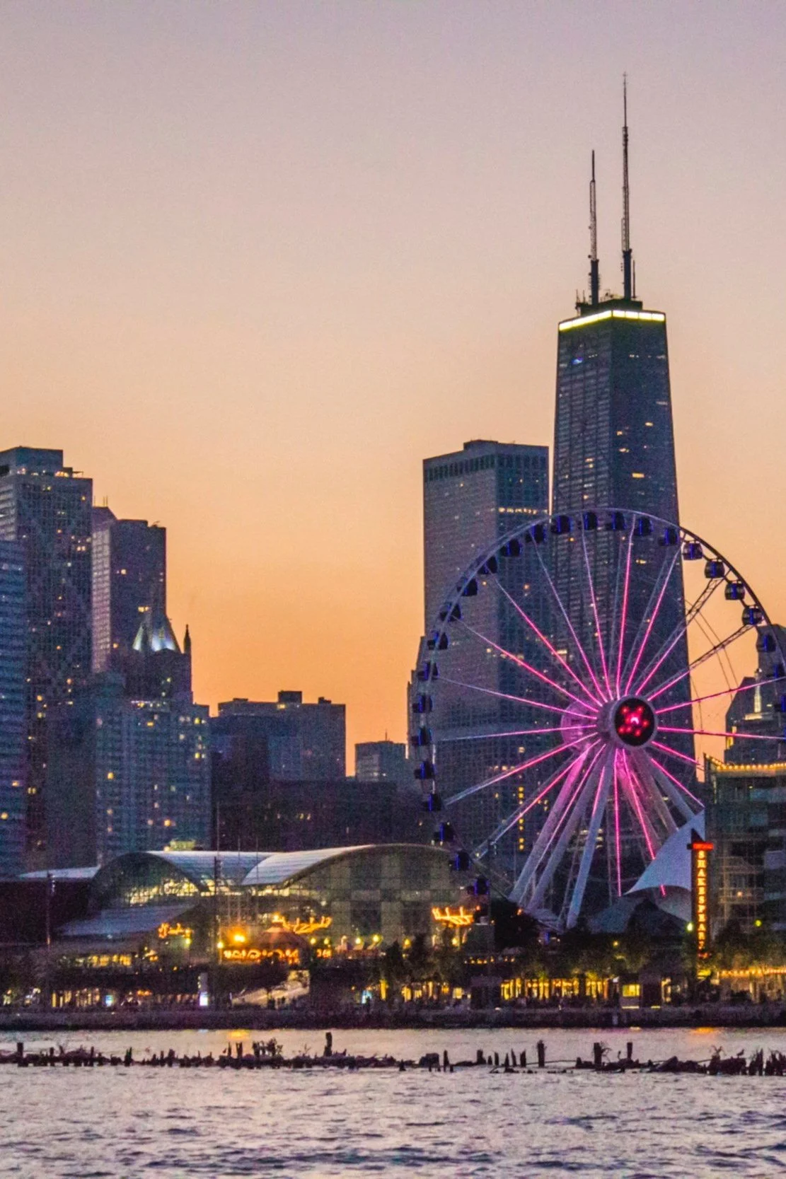 Vibrant Chicago skyline featuring iconic skyscrapers, with luxury hotels and restaurants, showcasing the city's dynamic urban landscape and travel experiences.