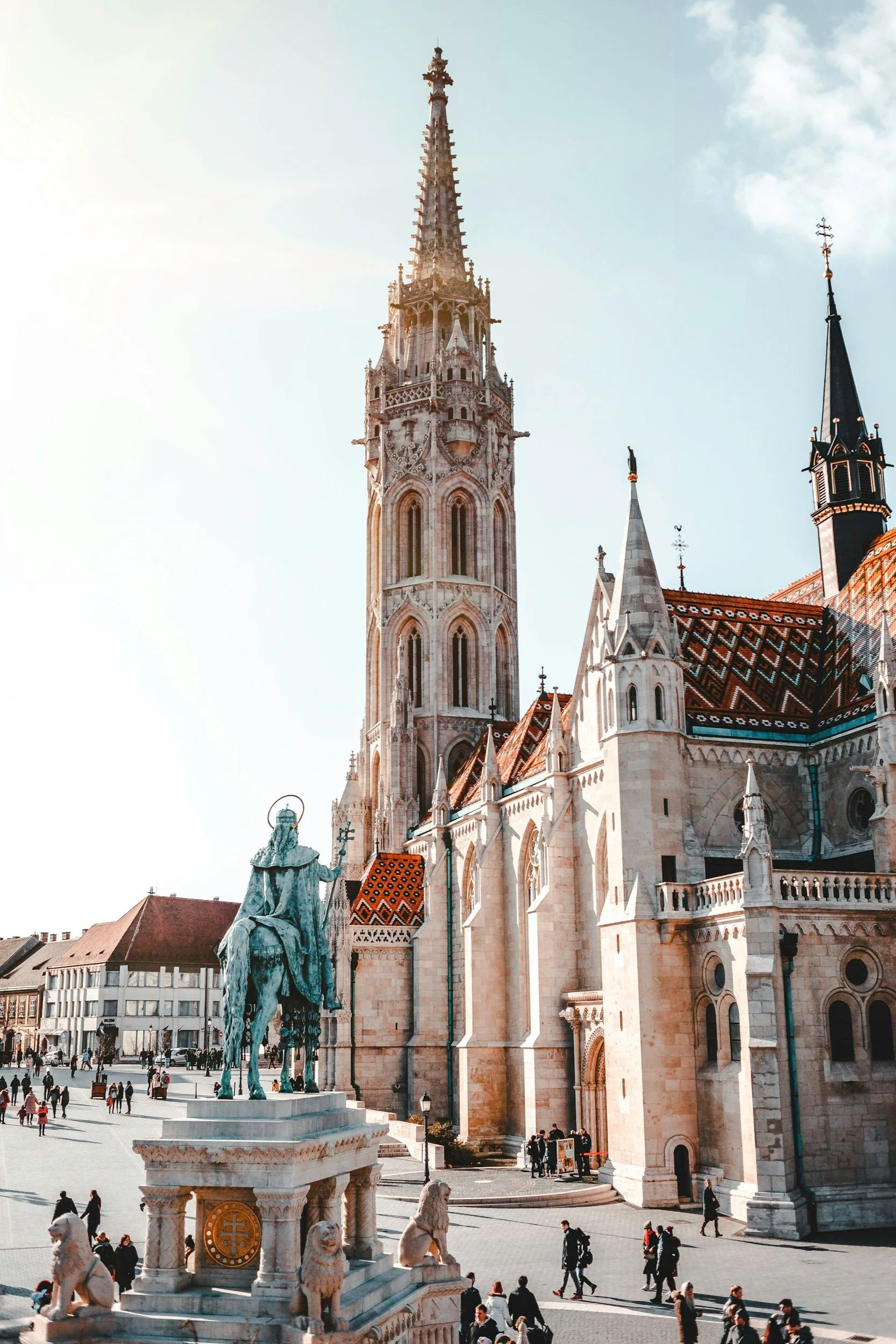 A stunning view of Budapest's skyline featuring the iconic Parliament Building and Buda Castle, showcasing luxury travel experiences with elegant accommodations and fine dining options along the Danube River.