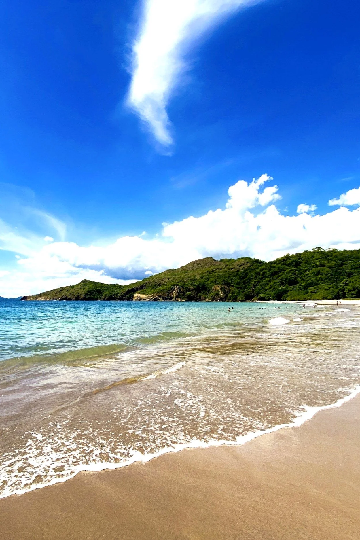 Scenic tropical beach with soft white sand and crystal-clear turquoise waters, showcasing a perfect destination for luxury travel and all-inclusive resort vacations.