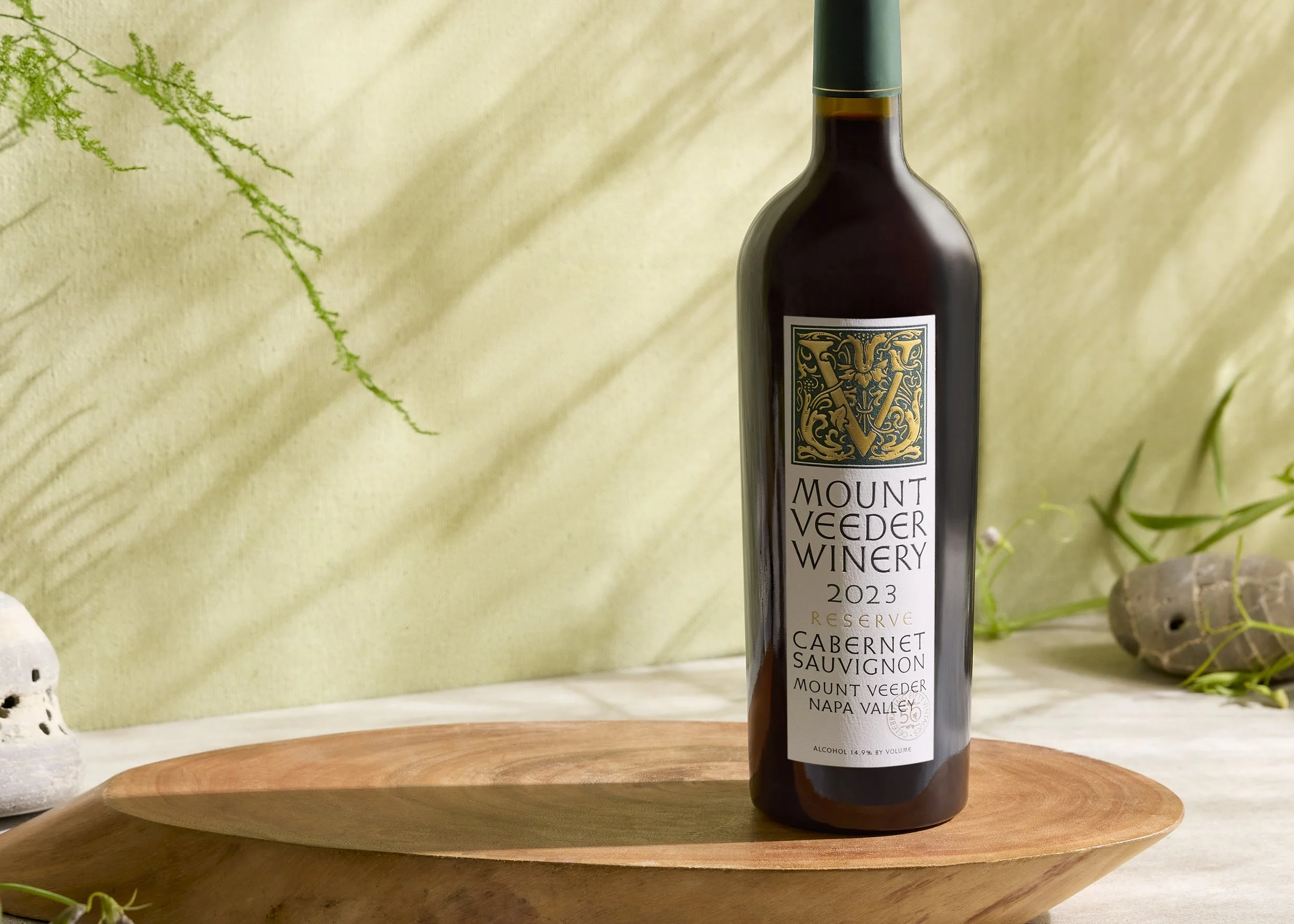 Mount Veeder Winery Napa Valley Cabernet Sauvignon anniversary label on wooden surface with sunny background