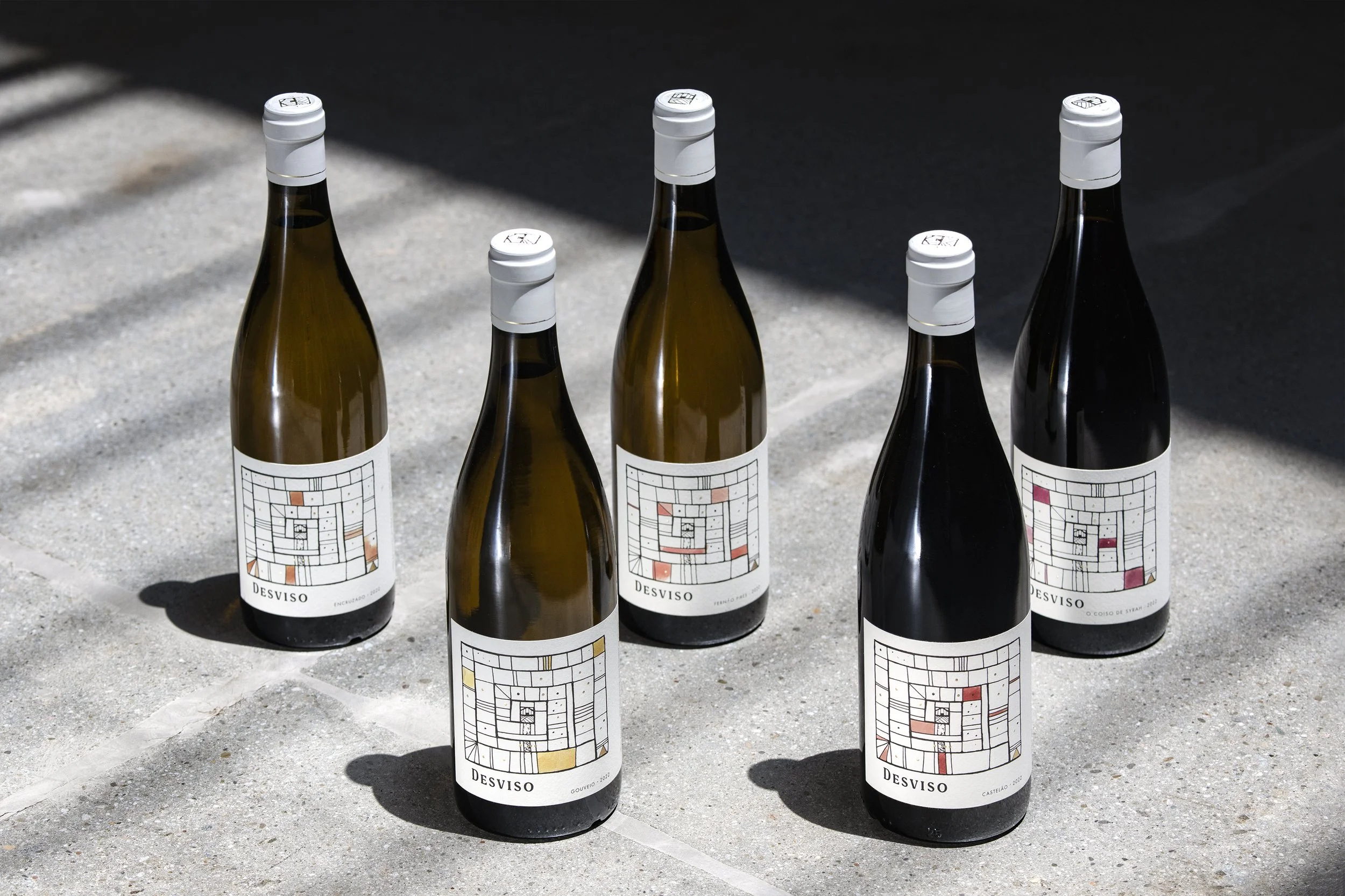 Desviso wines full label lineup on concrete floor