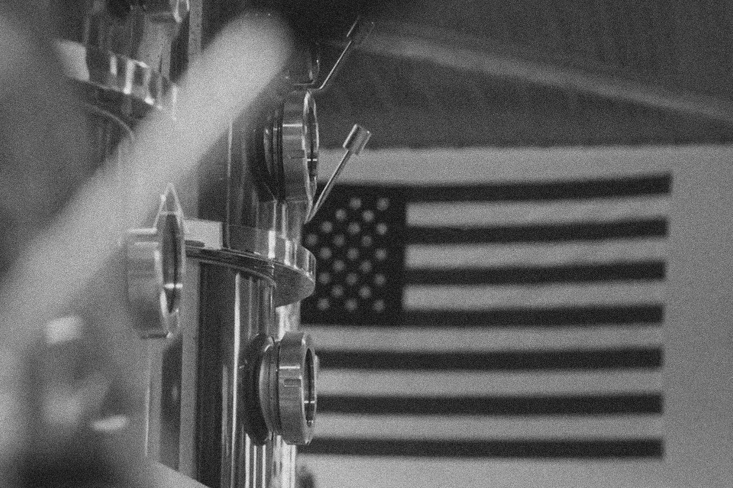 Mean Spirits Distillery Norfolk Virginia factory machinery with American flag behind
