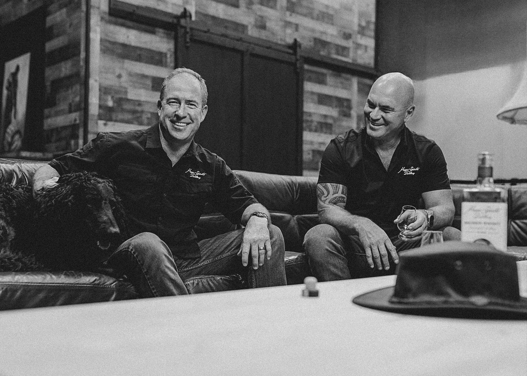 Mean Spirits Distillery Norfolk Virginia founders sitting on couch