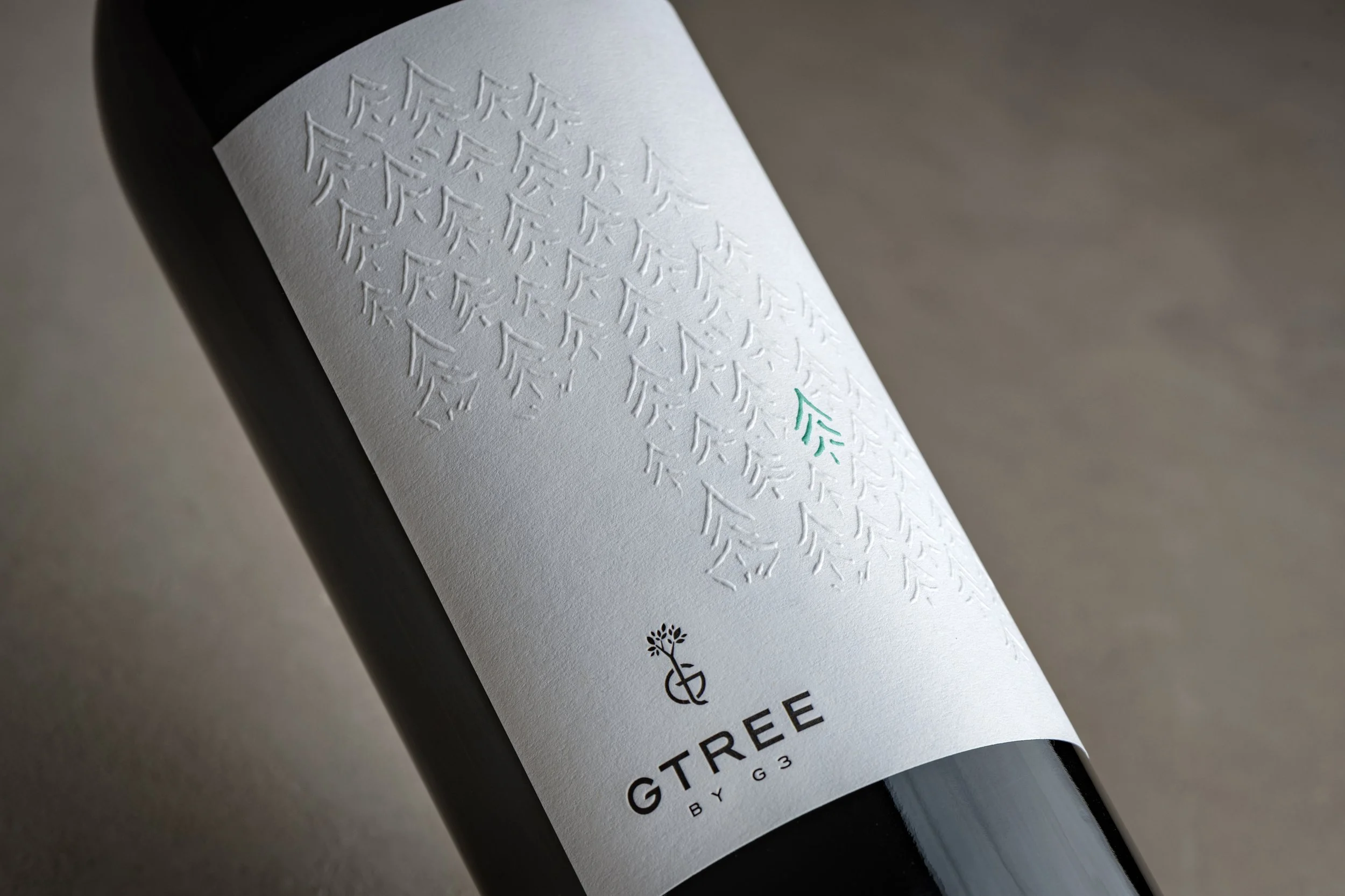 G3 GTREE Enterprises sustainability label with embossing detail of trees