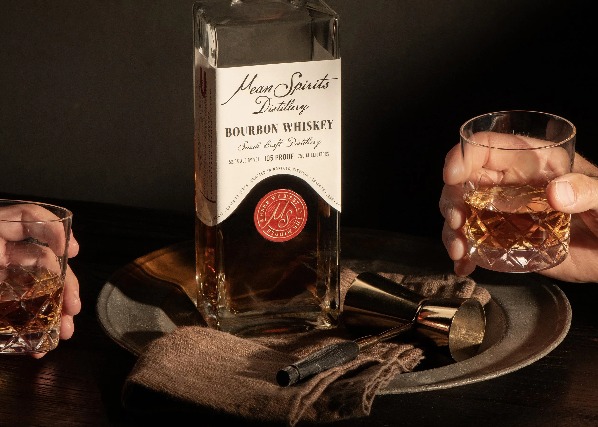 Mean Spirits Distillery Norfolk Virginia Bourbon Whiskey label with hands holding whiskey glasses