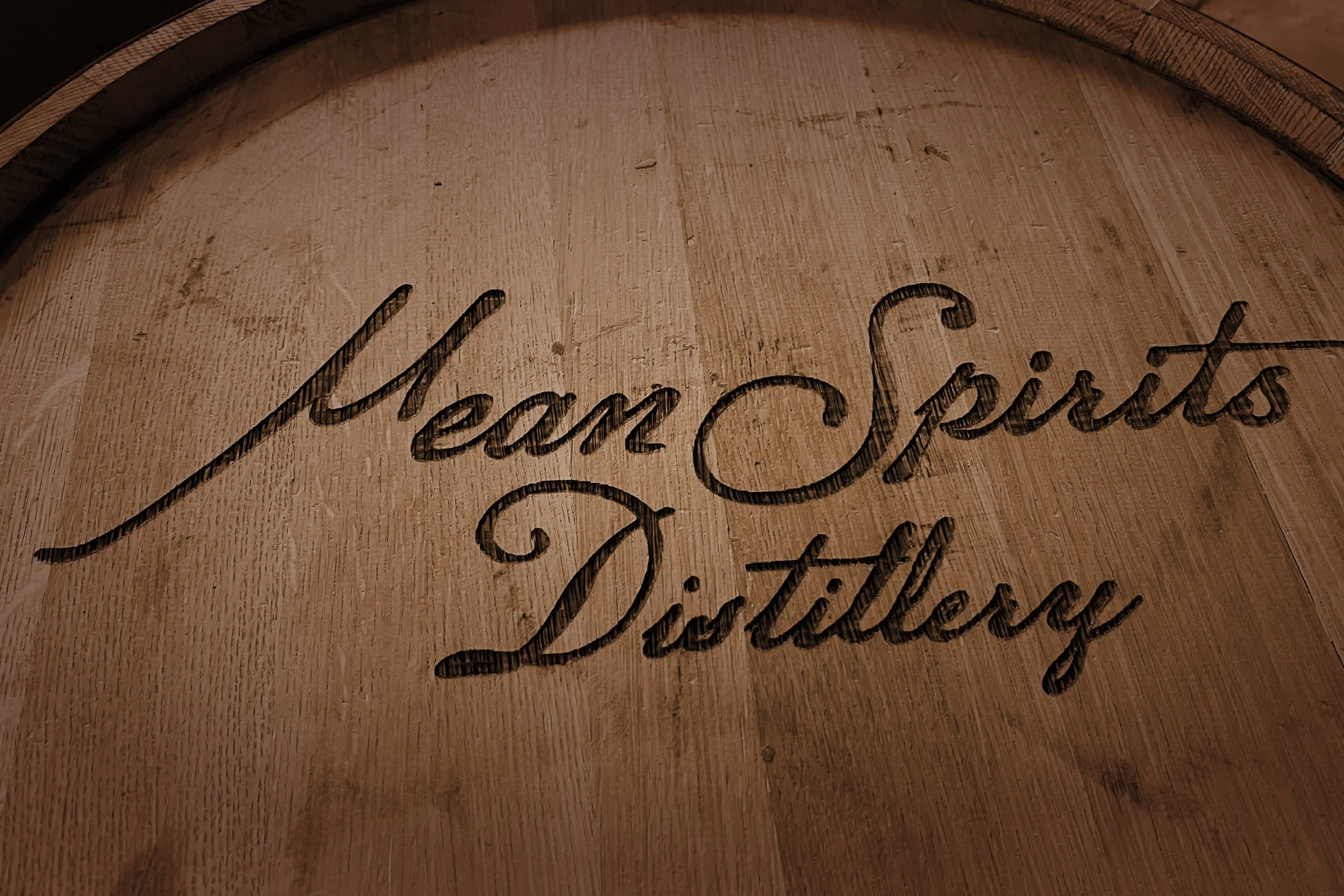 Mean Spirits Distillery Norfolk Virginia logo charred into barrel top