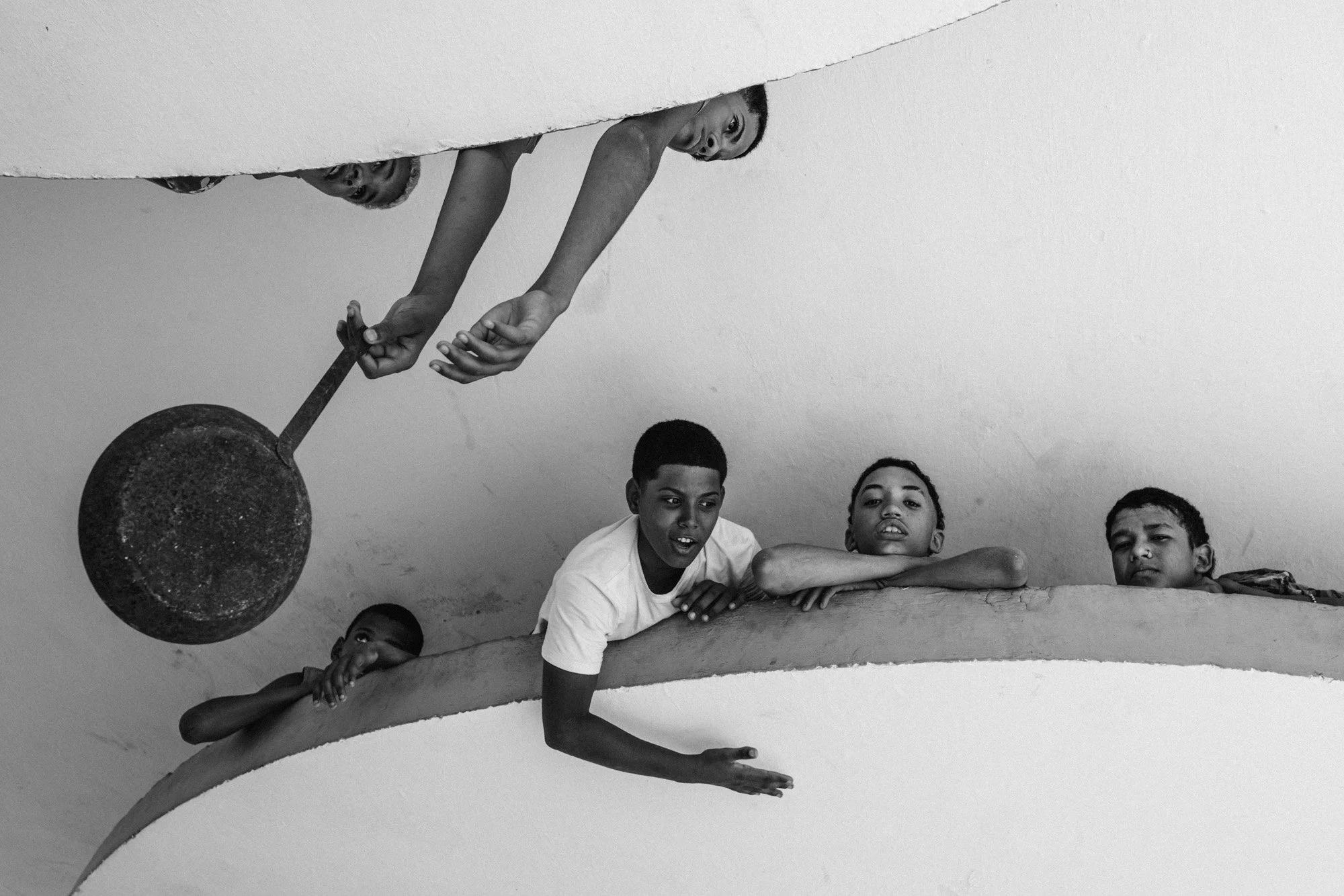 Boys playing at a bus shelter, Havana, 2023