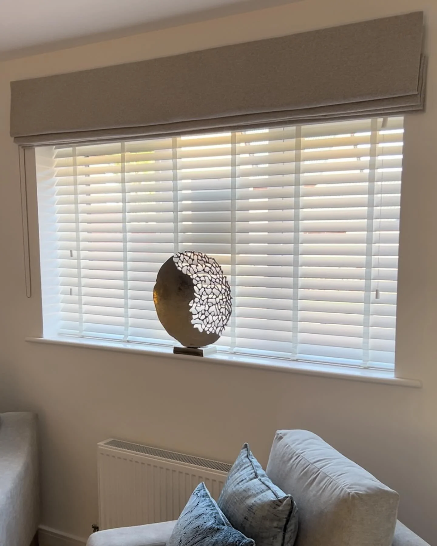 Can&rsquo;t decide on what style of blind to go for? These clients opted for both a venetian blind inside the window recess and a Roman blind to dress the window on the outside. We think it looks great, would you choose something similar in your home