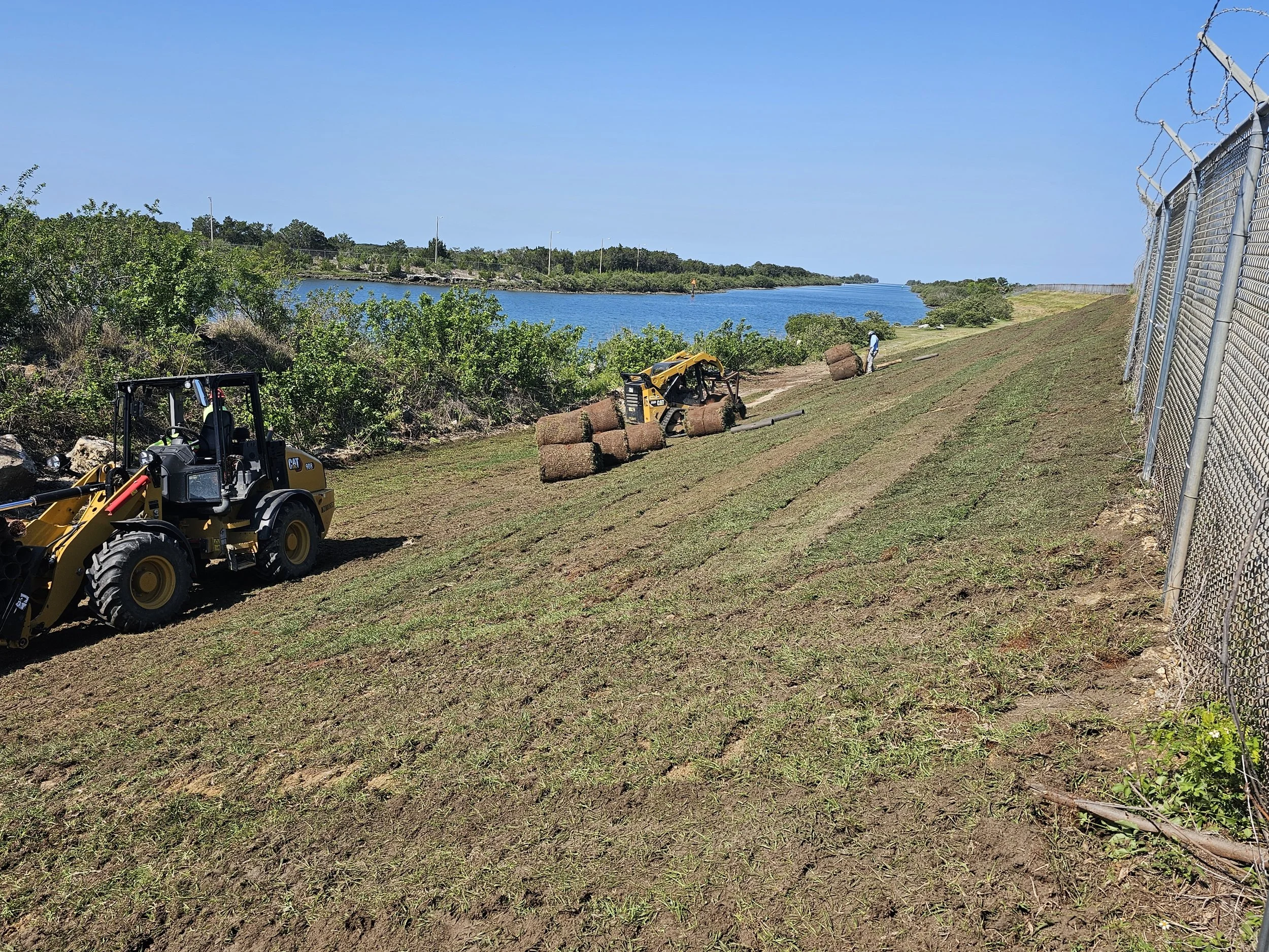 Slope remediation rolled sod installation