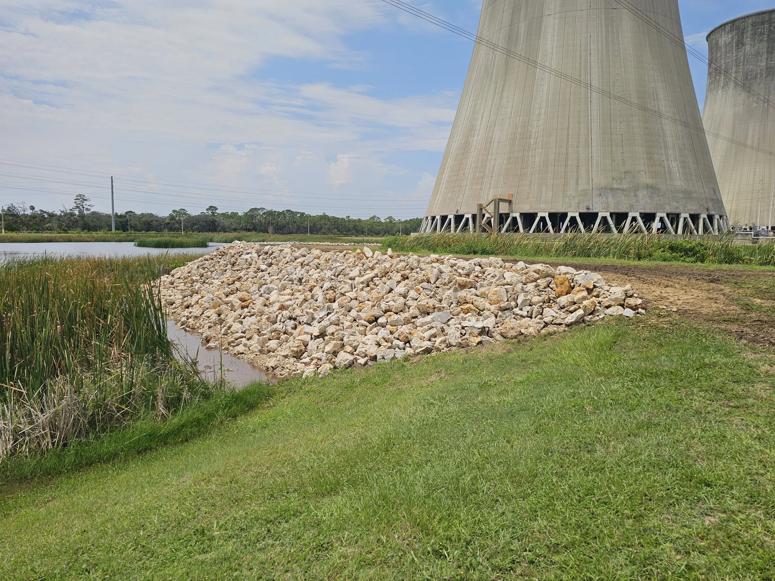 Rip rap erosion control limestone rock installation Duke Energy Florida