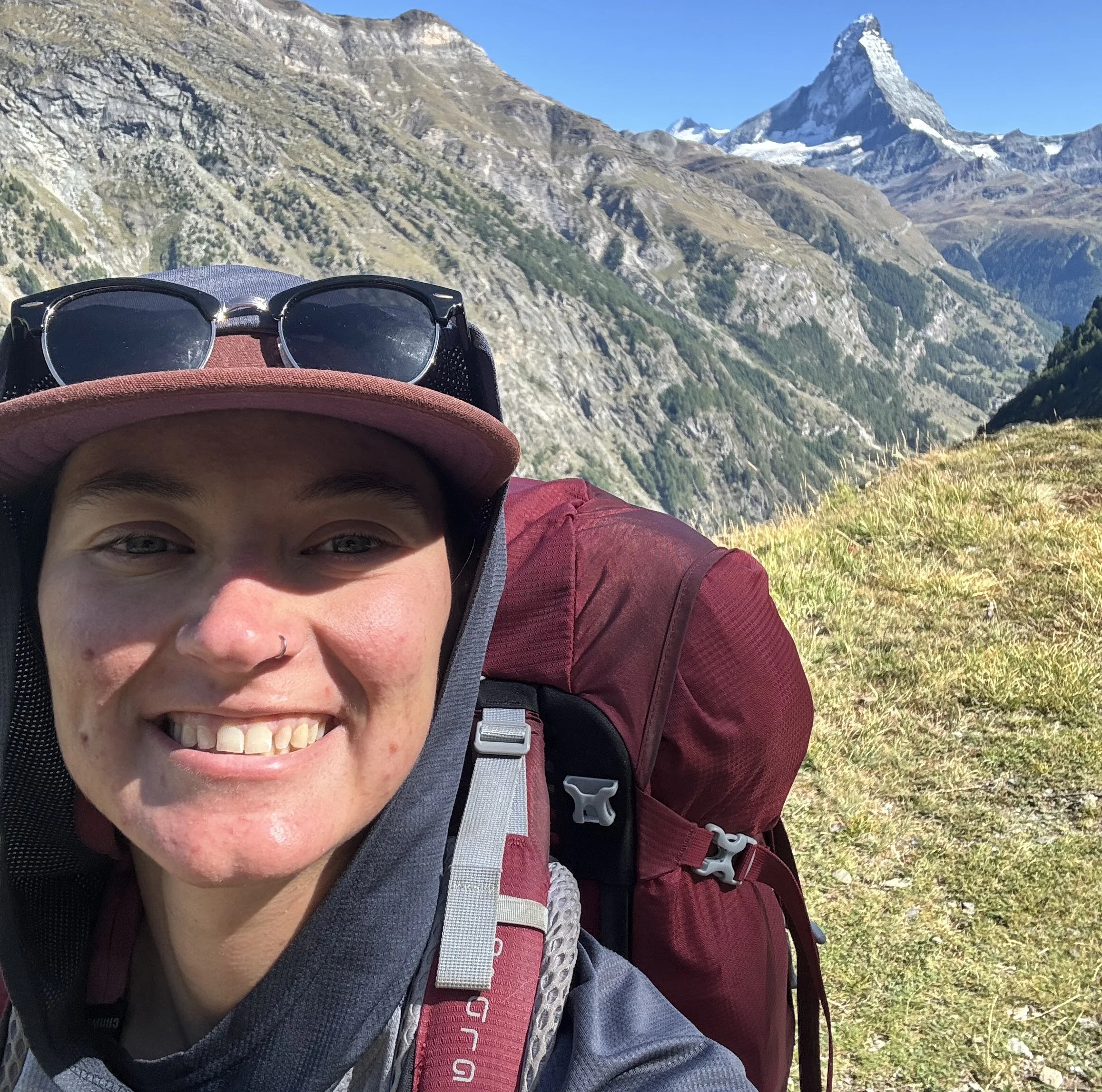 kate milller smiles with the matterhorn in the background