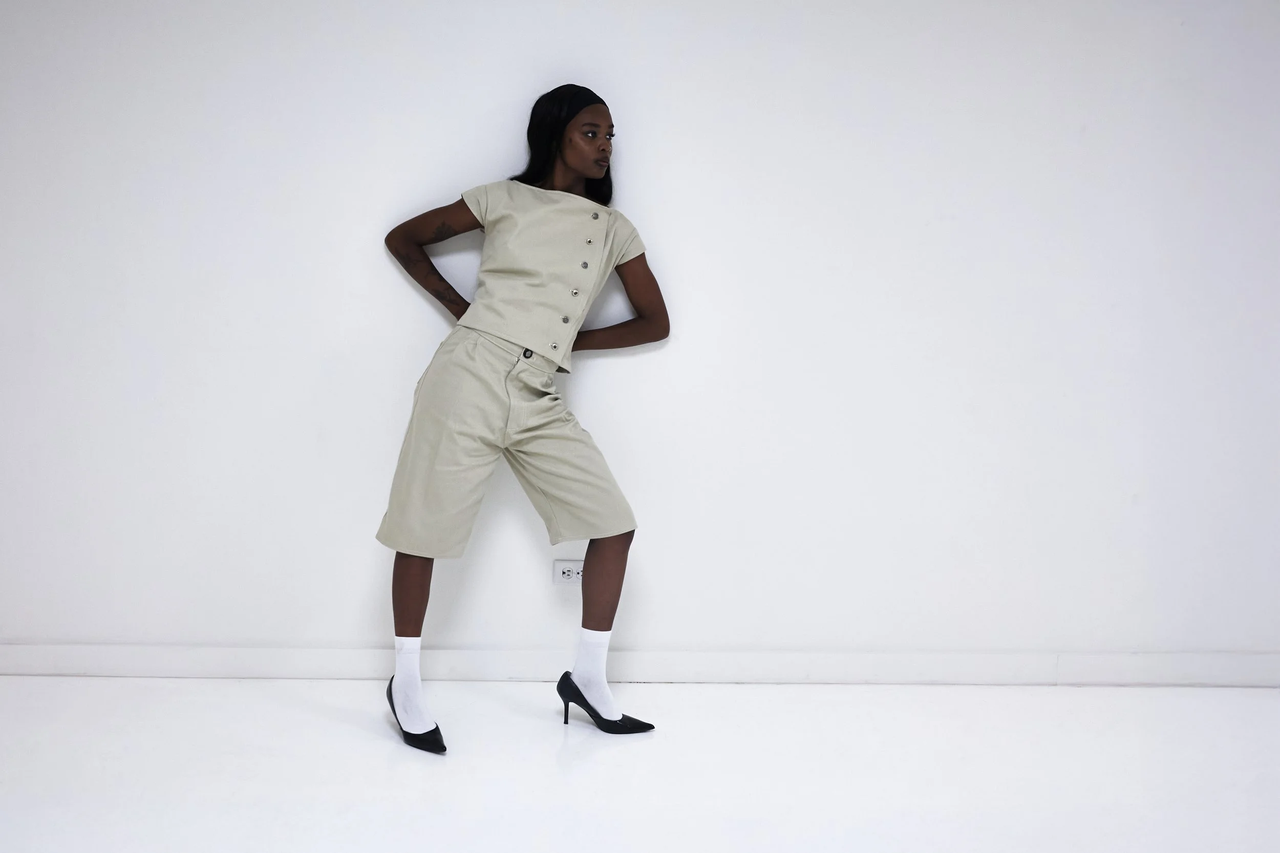 Pleated cream trouser shorts