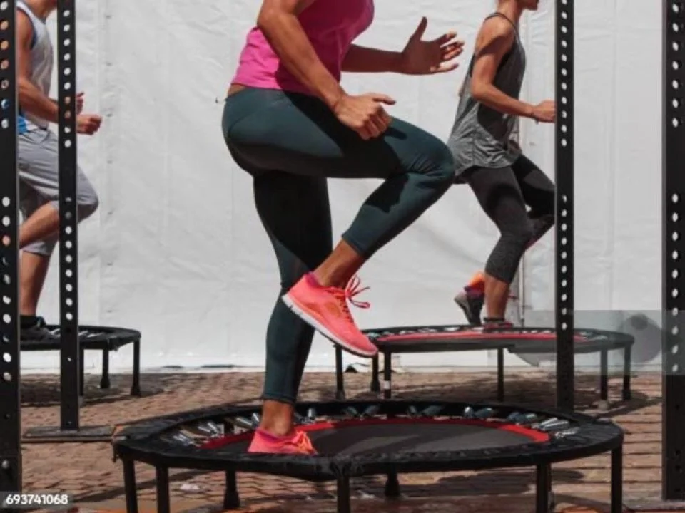People exercising on a step platform for the Kari Essentials Purposeful Living exercise and wellness section.