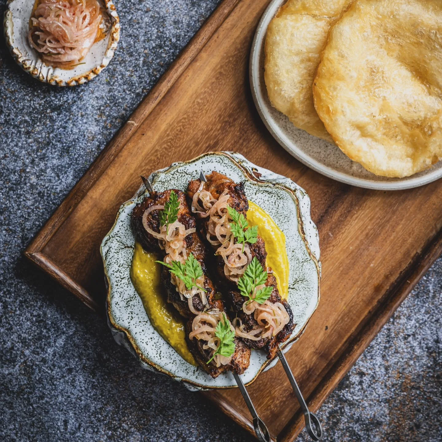 Lamb skewer - smoked bicol express sauce, shallot sambal, roti