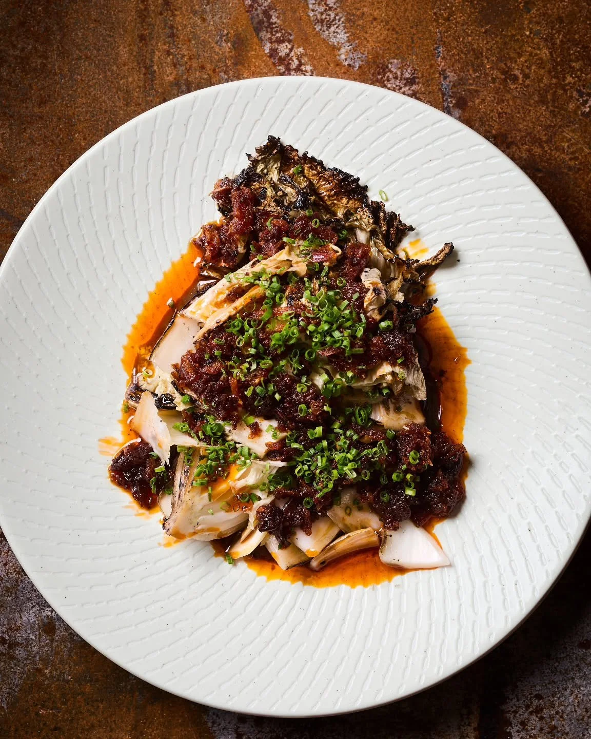 cabbage -woodfired napa cabbage, black garlic toum, shallot sauce, peanuts

📸 @manjawachsmuth
