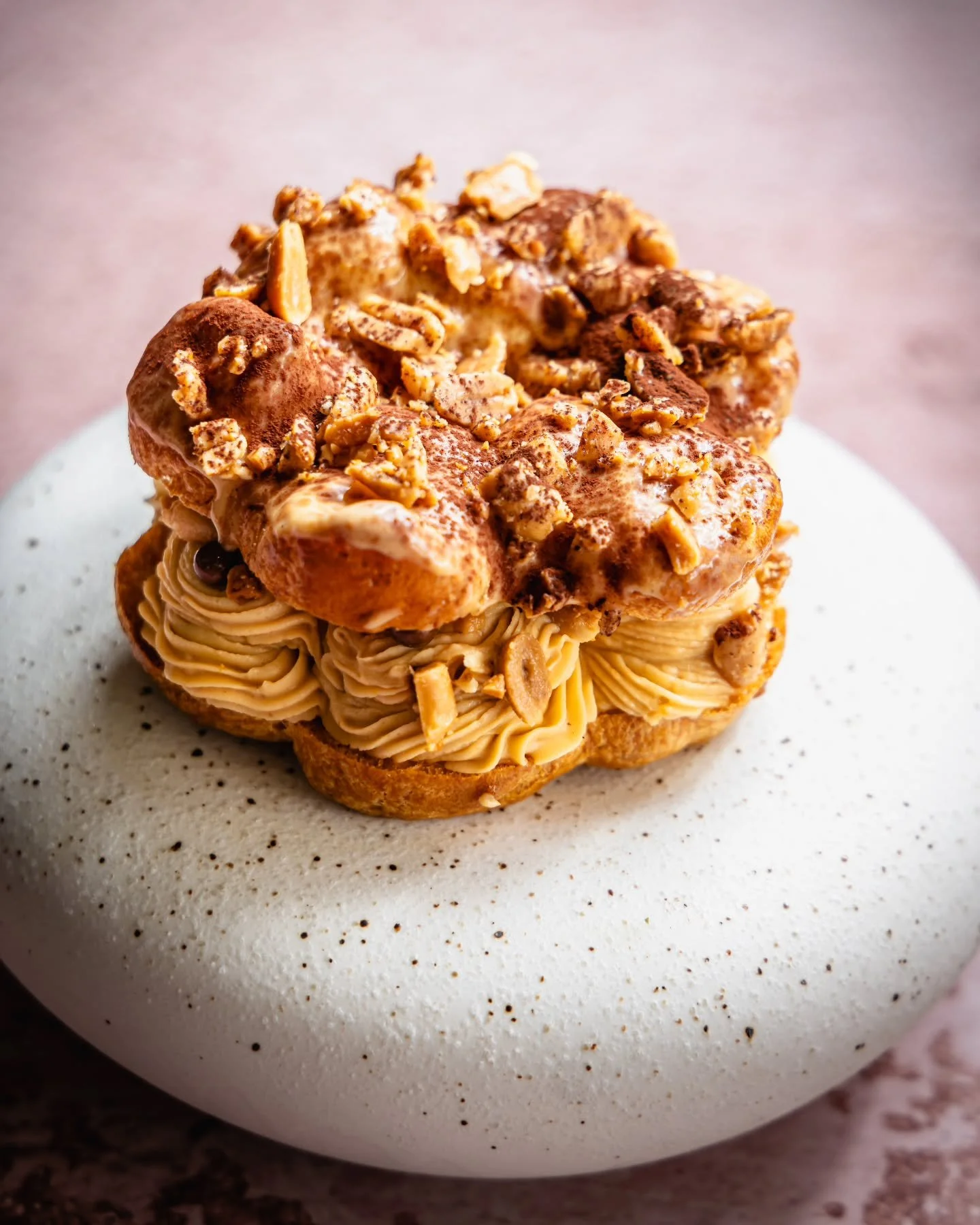 Choc-Nut Paris-Brest
P&acirc;te &agrave; choux filled with chocolate-peanut gianduja mousse, finished with a patis caramel glaze (Filipino fish sauce).

A modern homage to the nostalgic Choc-Nut bar, reimagined with a balance of sweet, salty, and uma