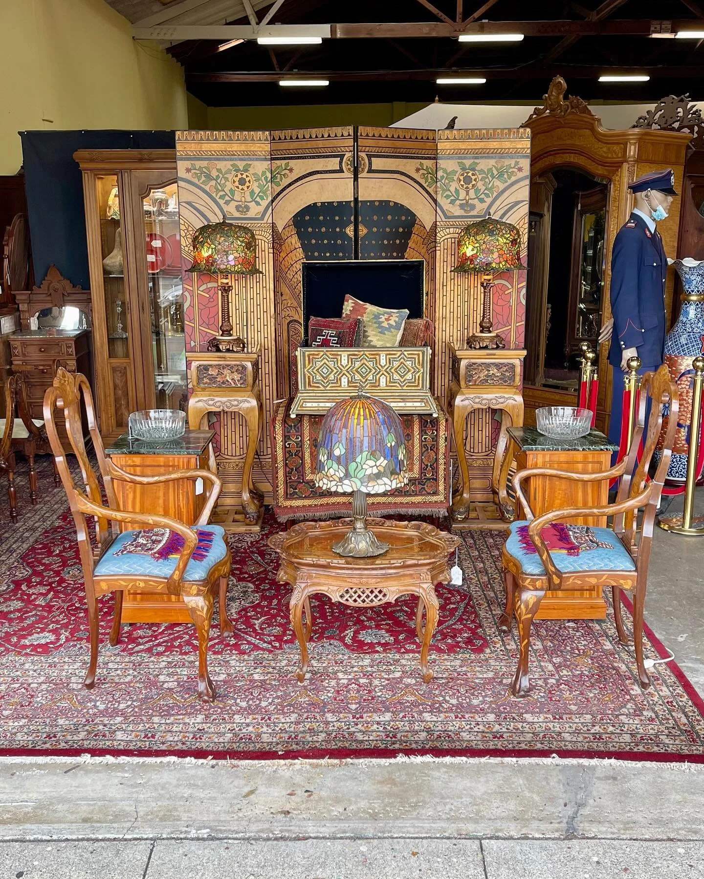 Our latest front display!

* Large Leaded Glass Table Lamp
* Pair of  French Neo-Classic Inlaid Mahogany Nightstands - circa 1910
* Pair of 19th Century Chippendale Walnut Arm Chairs with Dutch Marquetry 
* Pair of Leaded Glass Table Lamps
* Engraved