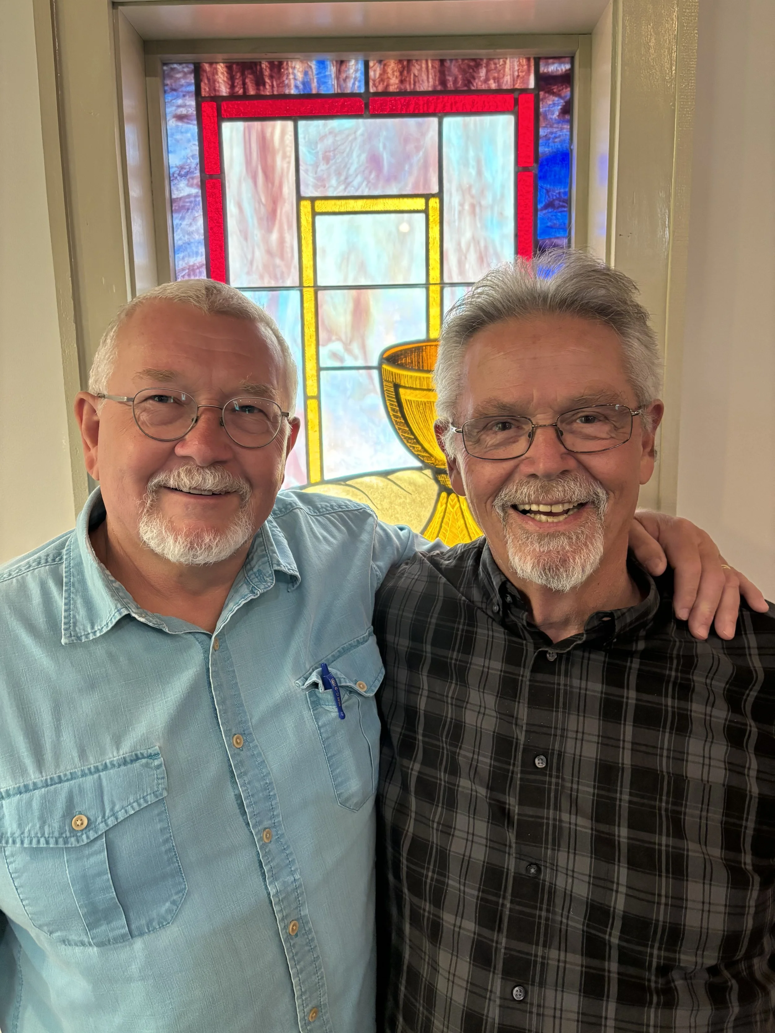 Picture of Baptist pastors in front of stained glass