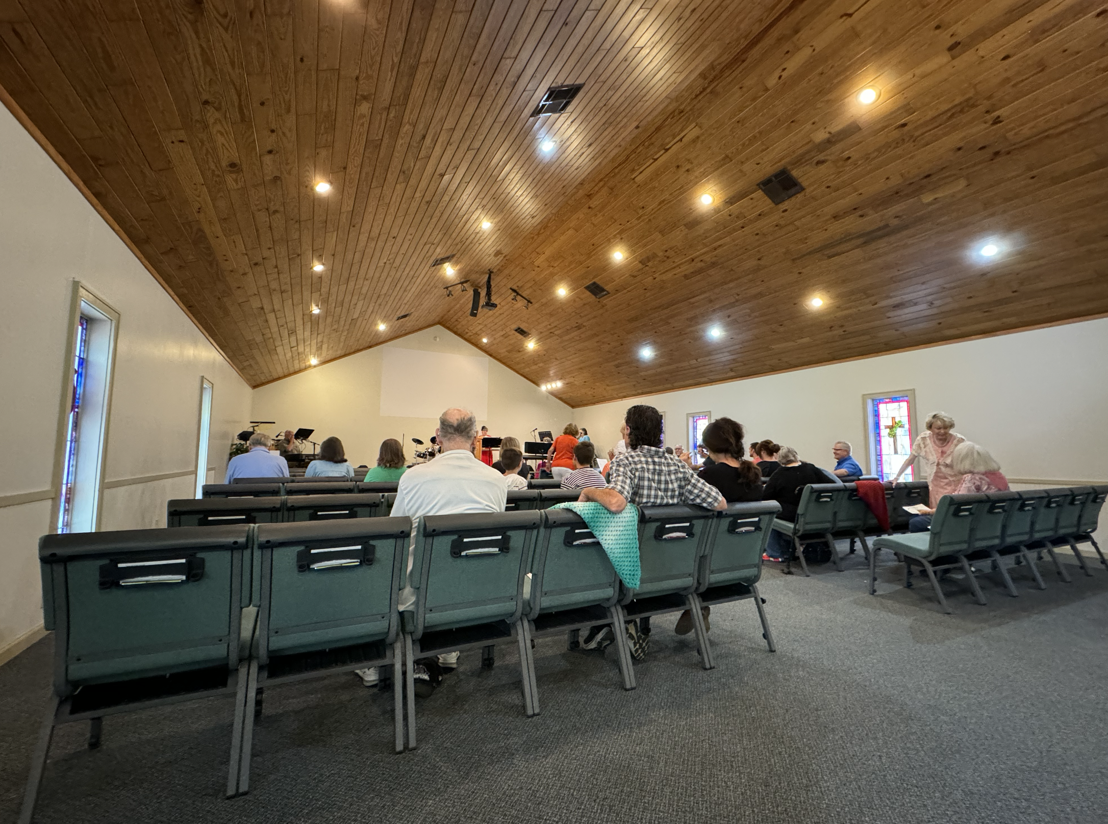 Who we are view of church - picture of people attending church from behind towards pulpit - expository Bible teaching at Foothills Bible Church