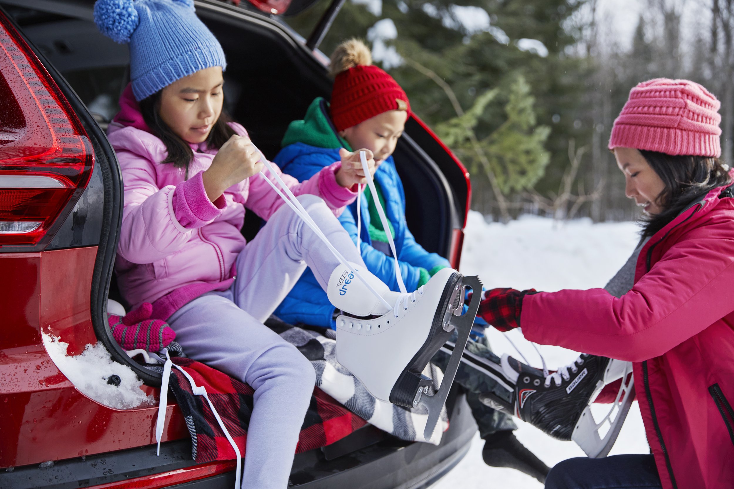 Mom getting kid dressed for skating_A.jpg