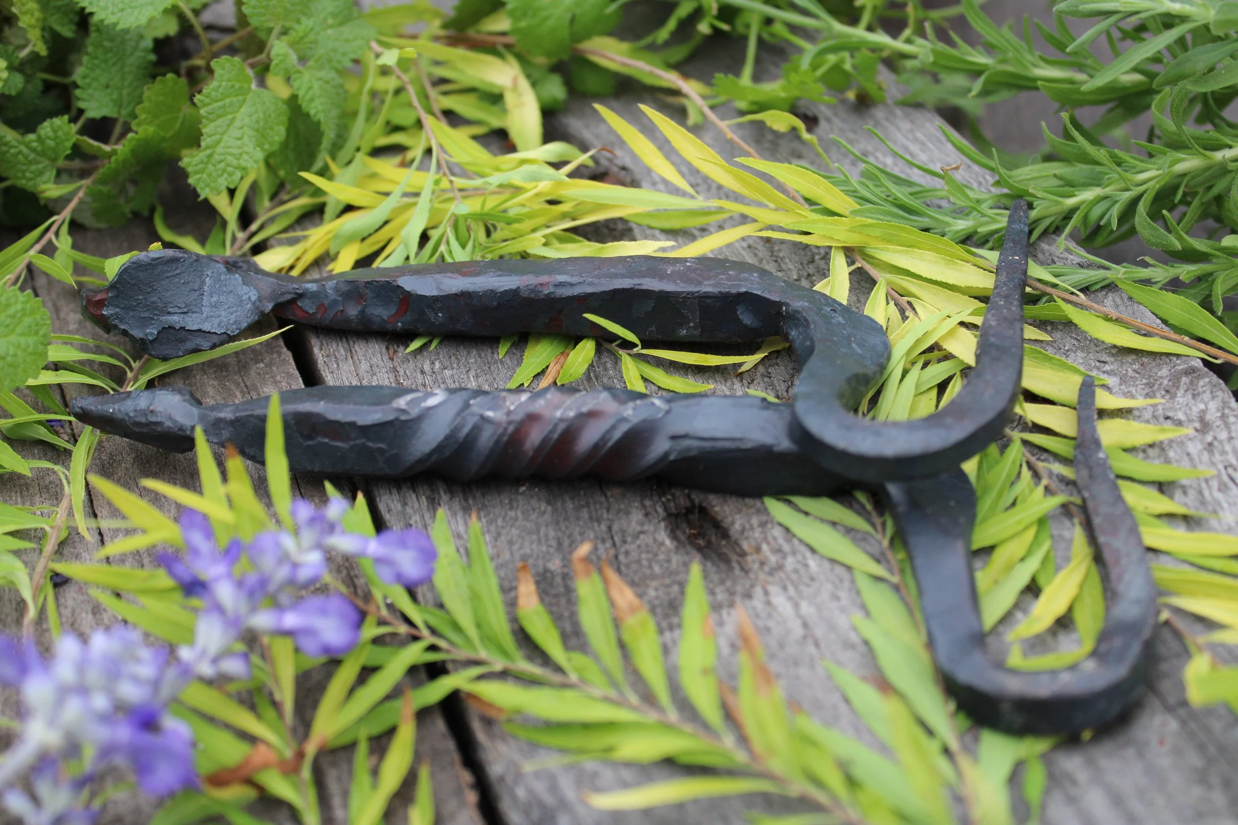  two hand made bottle openers