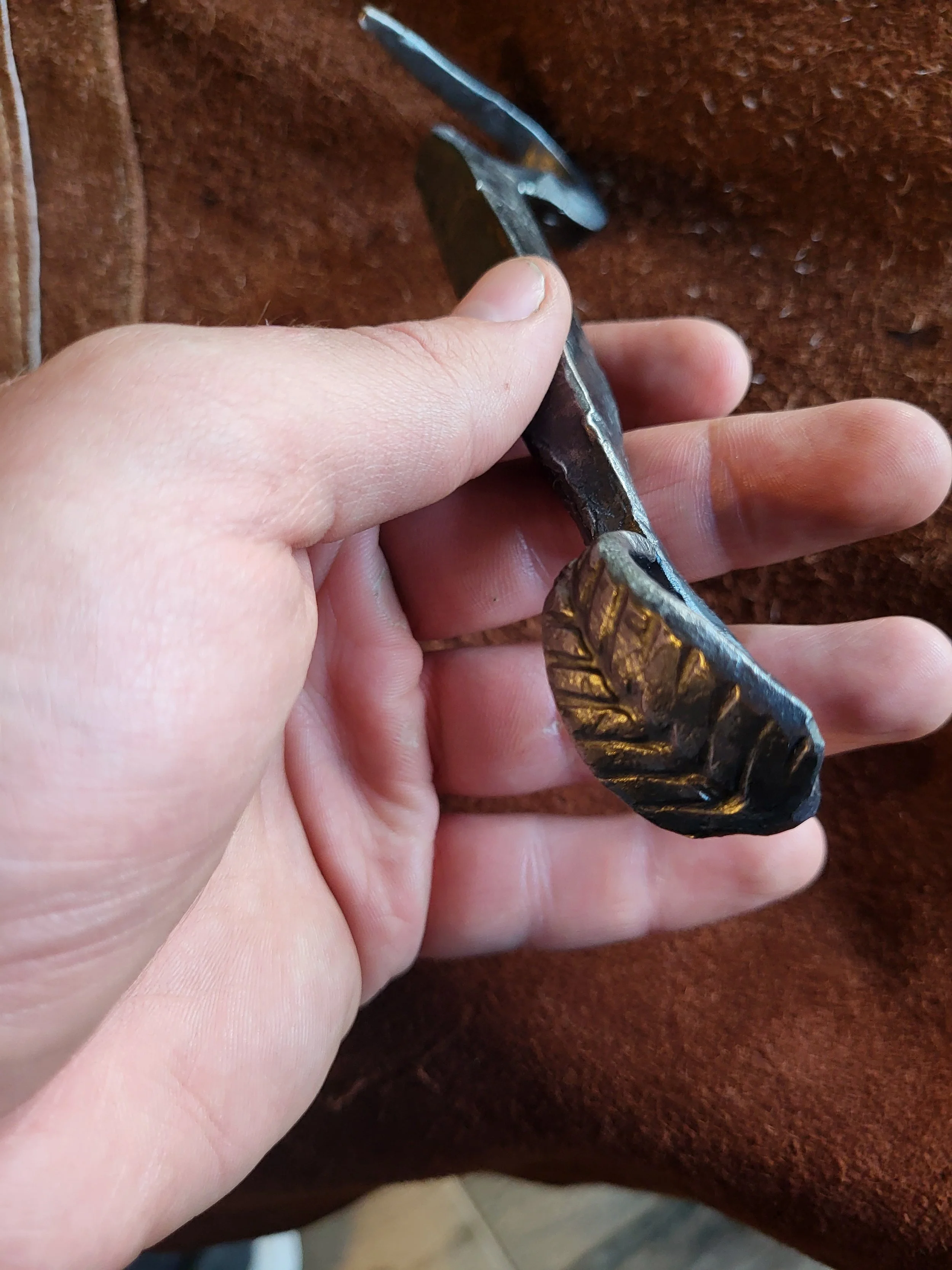 Handmade-bottle-opener-in-hand