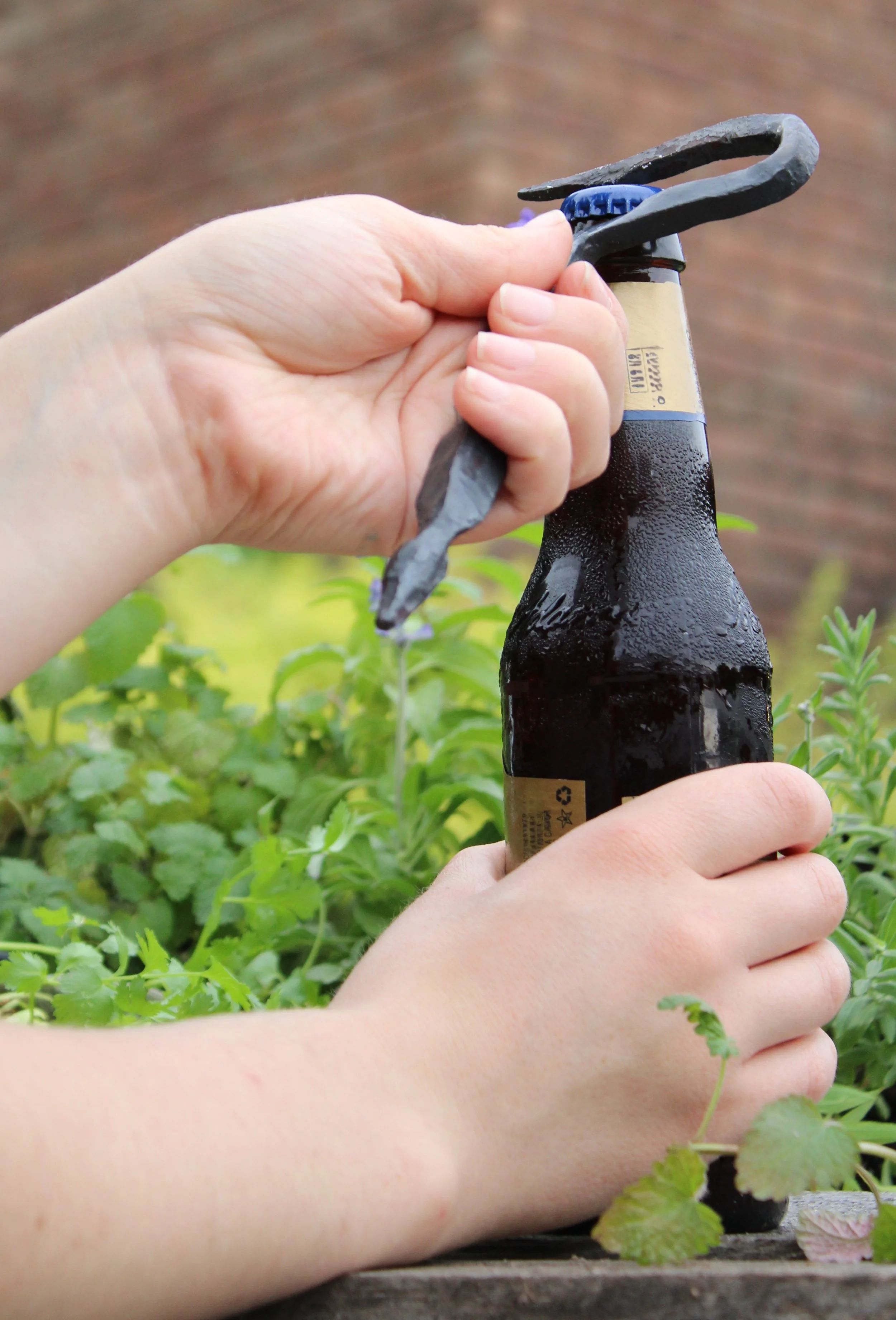 Using a hand forged bottle opener