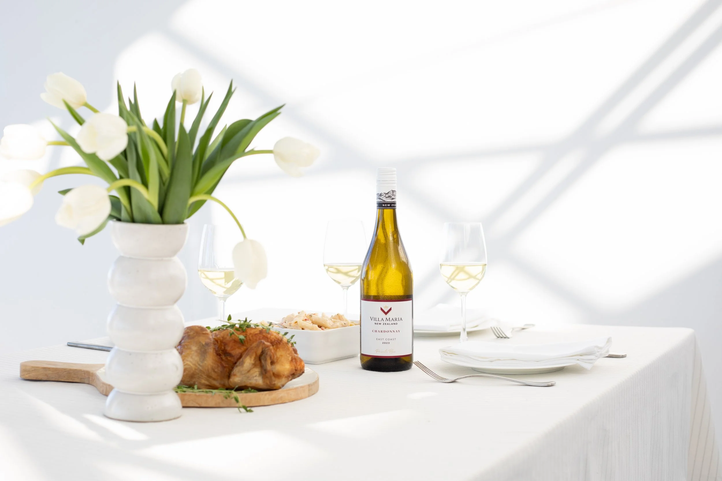Wine photography featuring a bottle of Villa Maria Chardonnay styled in a lifestyle setting