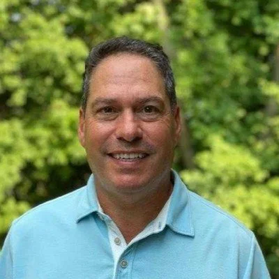 Shel Mann, CEO of FireflyVR, smiling in an outdoor setting.