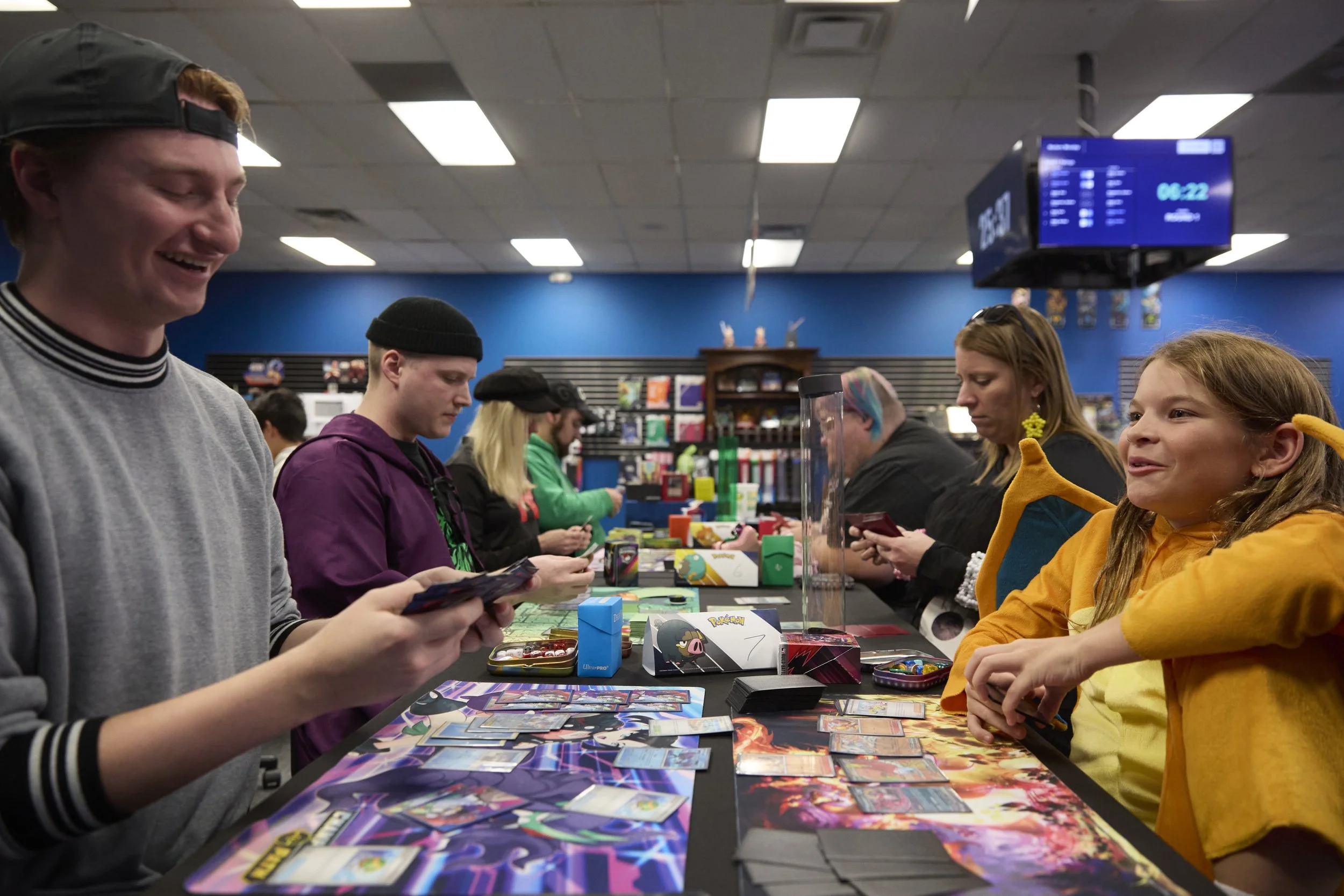 Left to right, Caleb Huebner and Vin Rist play Pokémon on Oct 27, 2025, at Deep Dive Games in Athens, Ohio. On Monday nights, Pokémon is the dedicated card game where players come in to compete for points to earn a chance at nationals. 