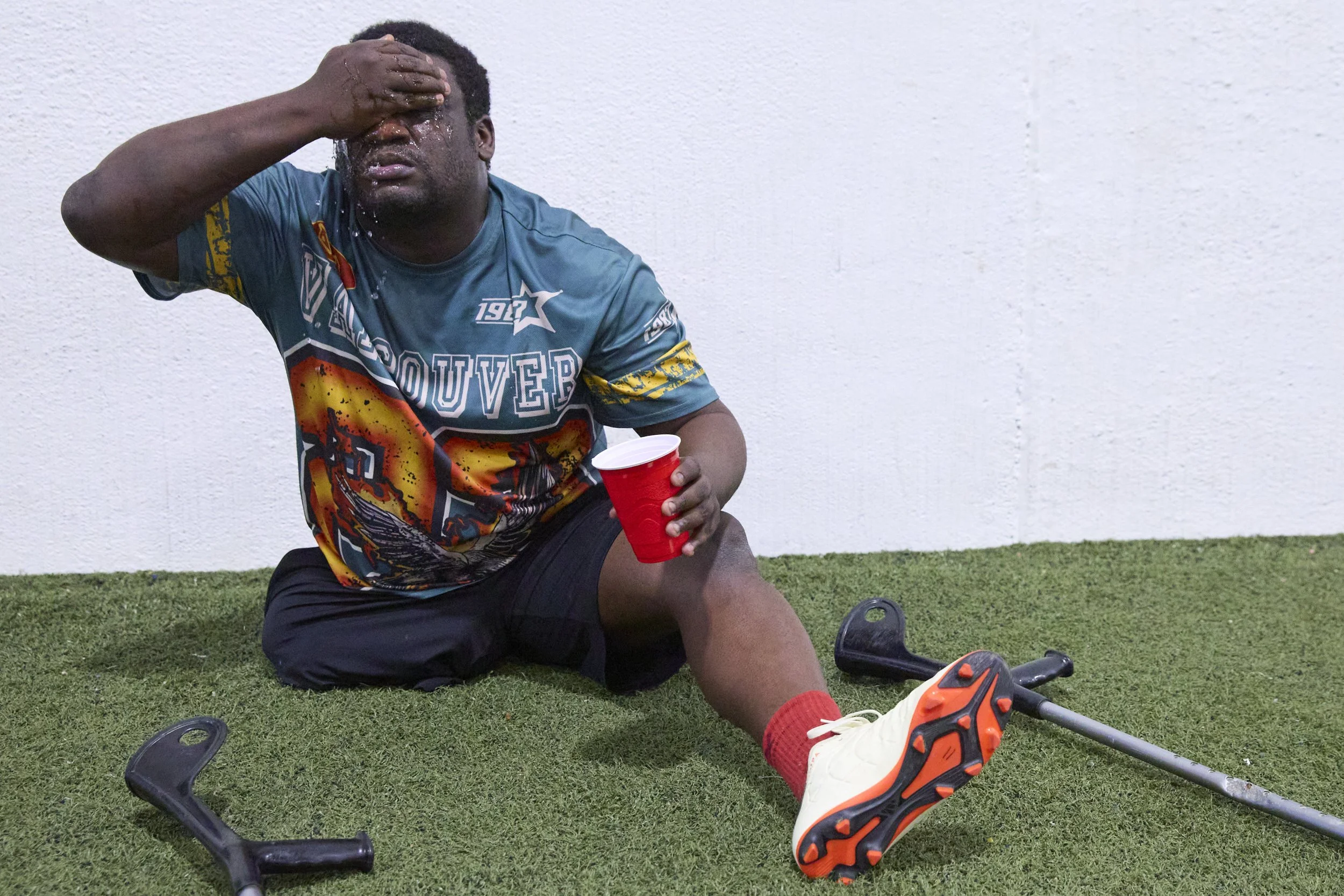 Manley Osias pours water on his face during an amputee soccer practice with Greater Ohio Athletic Soccer Team at TOCA soccer complex in Columbus, Ohio on March 22, 2026. 